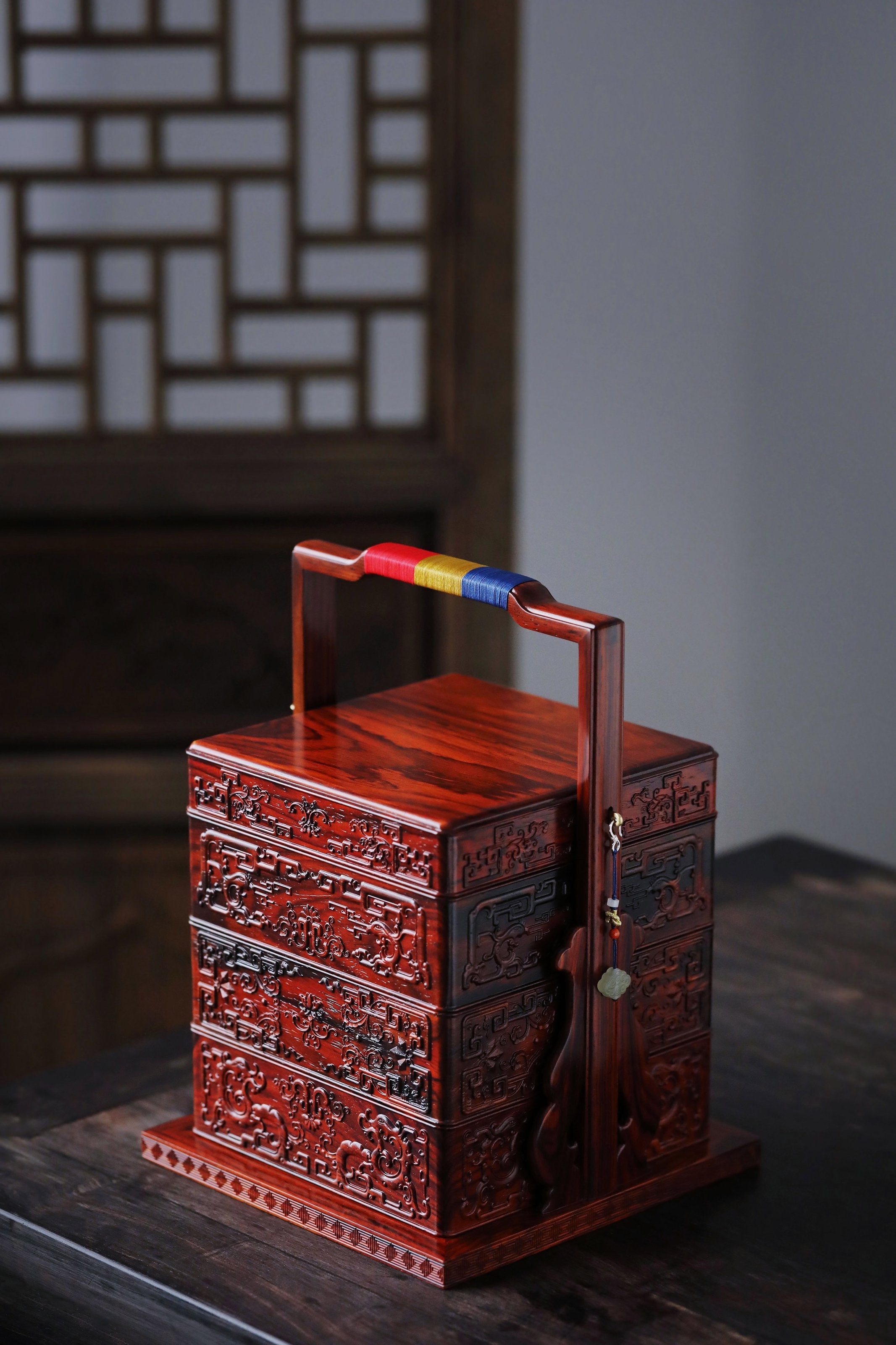 Rosewood square box with carved dragon and phoenix patterns