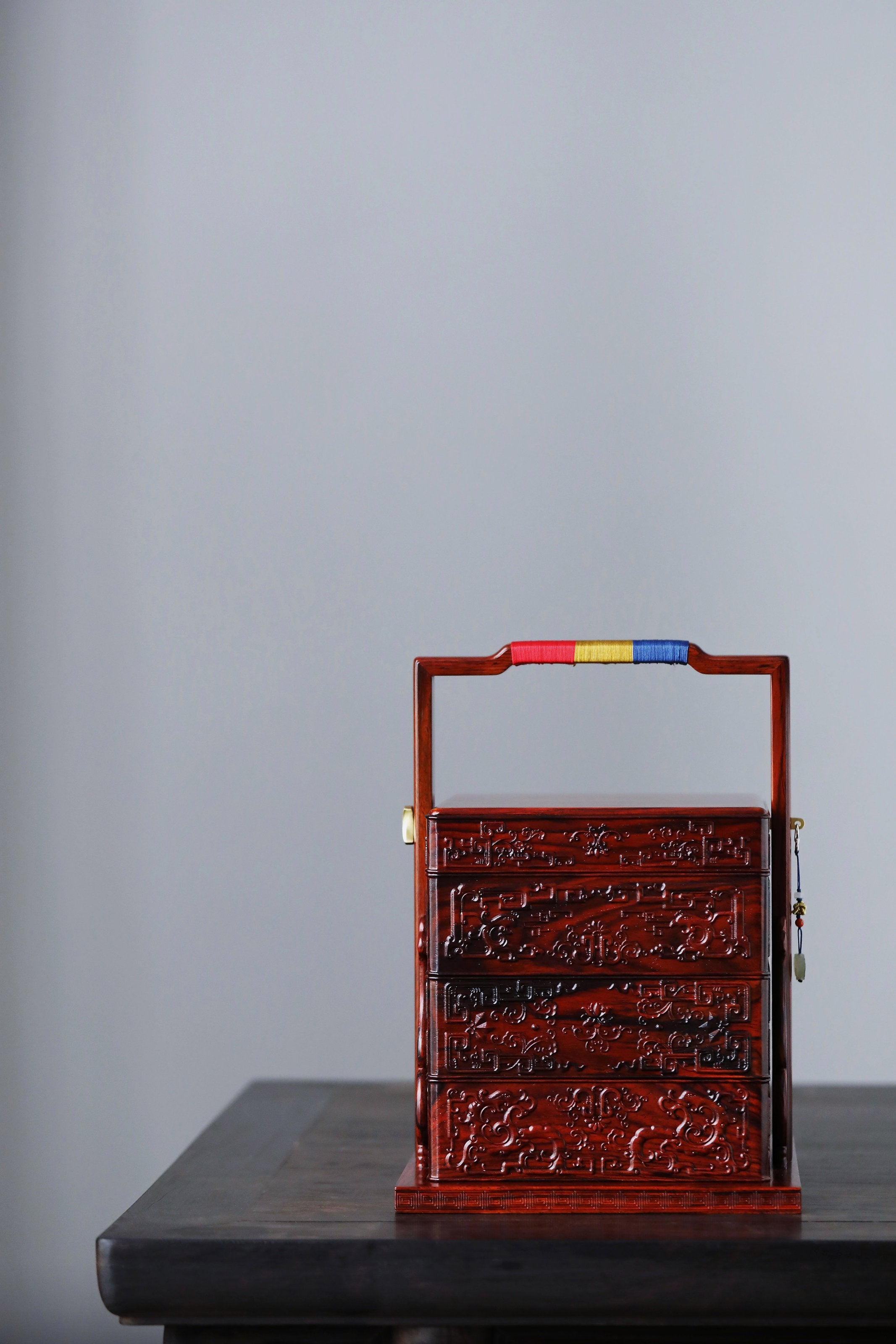 Rosewood square box with carved dragon and phoenix patterns