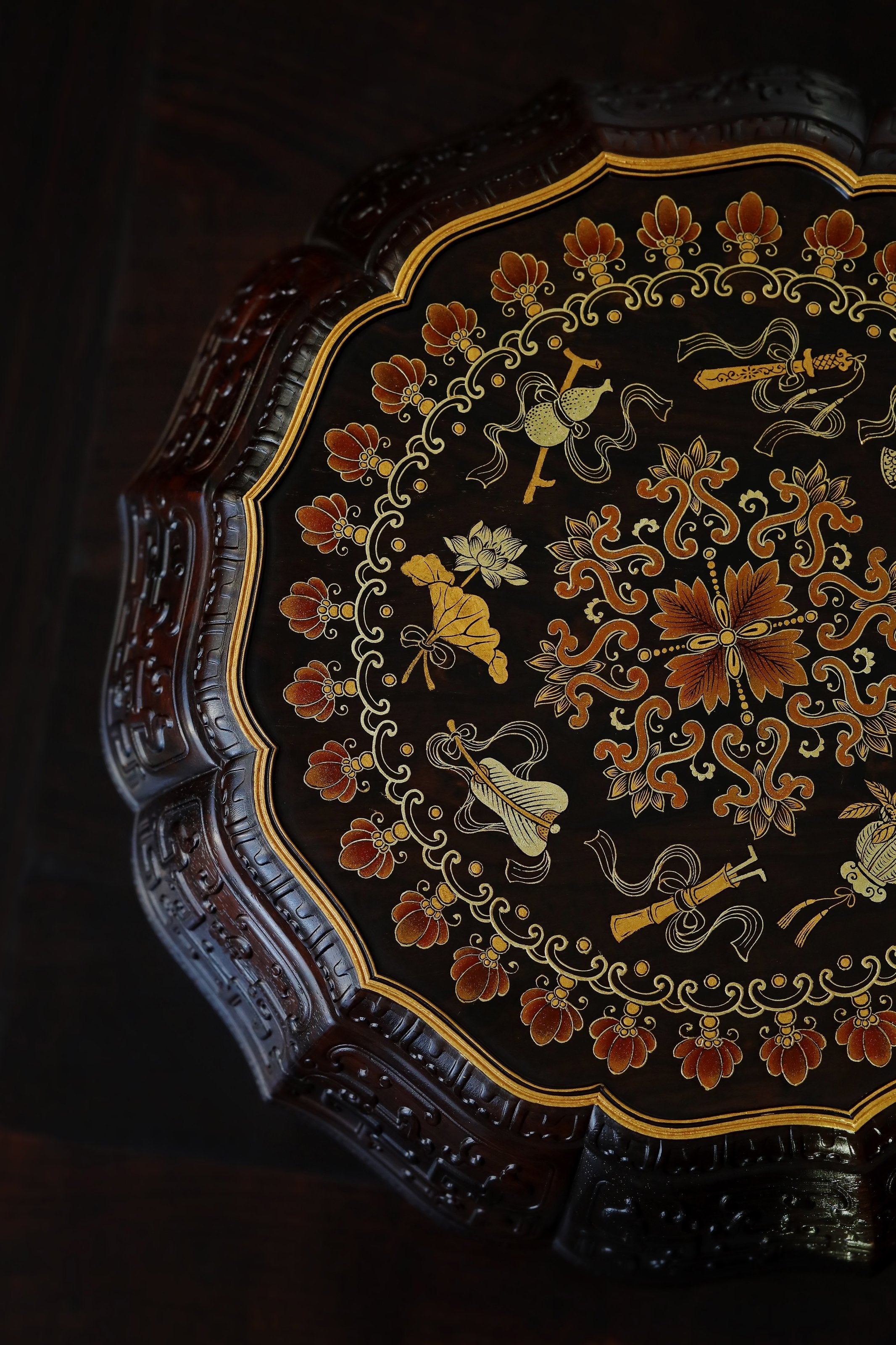 Purple sandalwood twelve-cornered fruit box with gilded Eight Immortals design and sunflower-shaped opening.