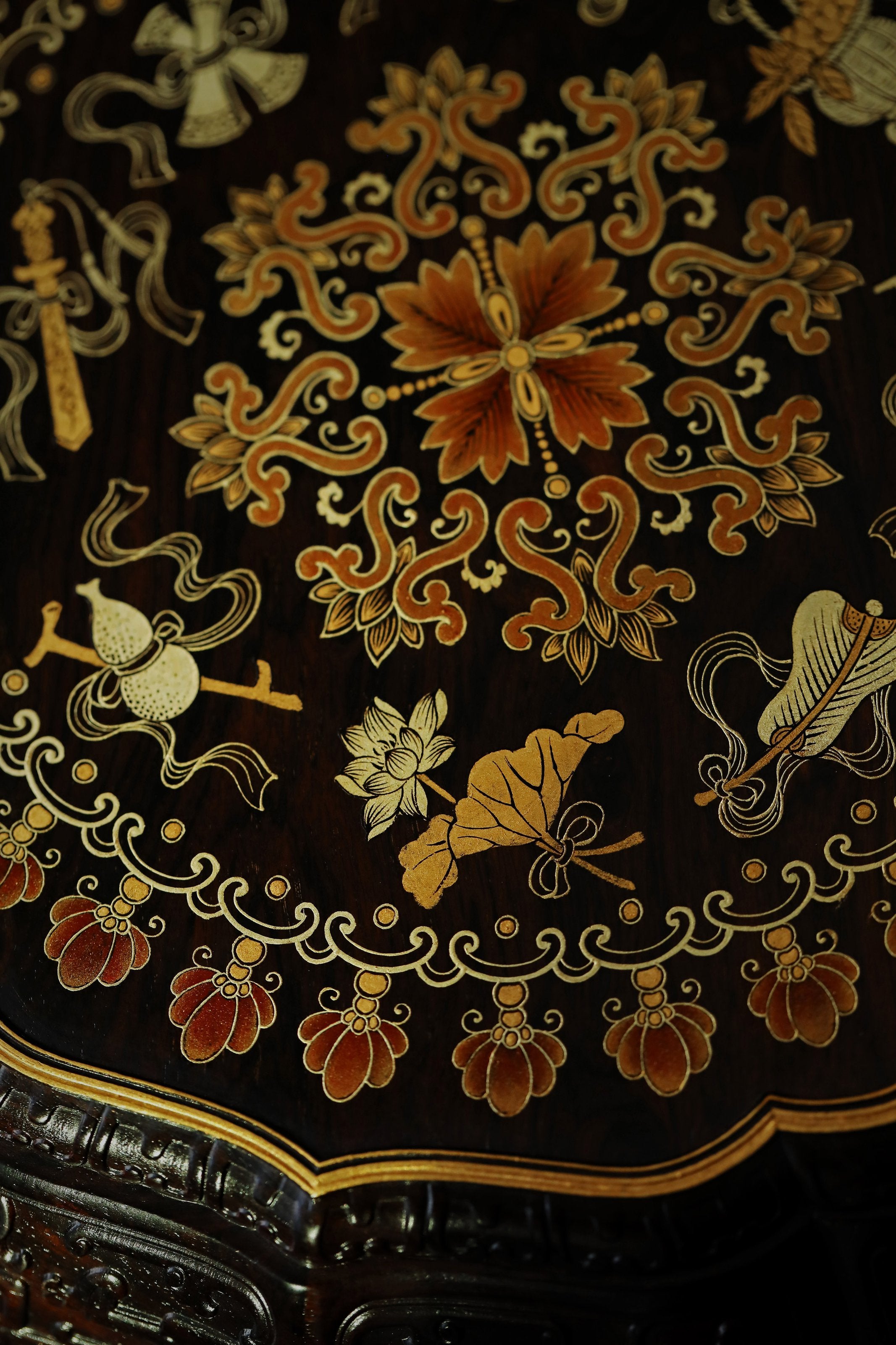 Purple sandalwood twelve-cornered fruit box with gilded Eight Immortals design and sunflower-shaped opening.