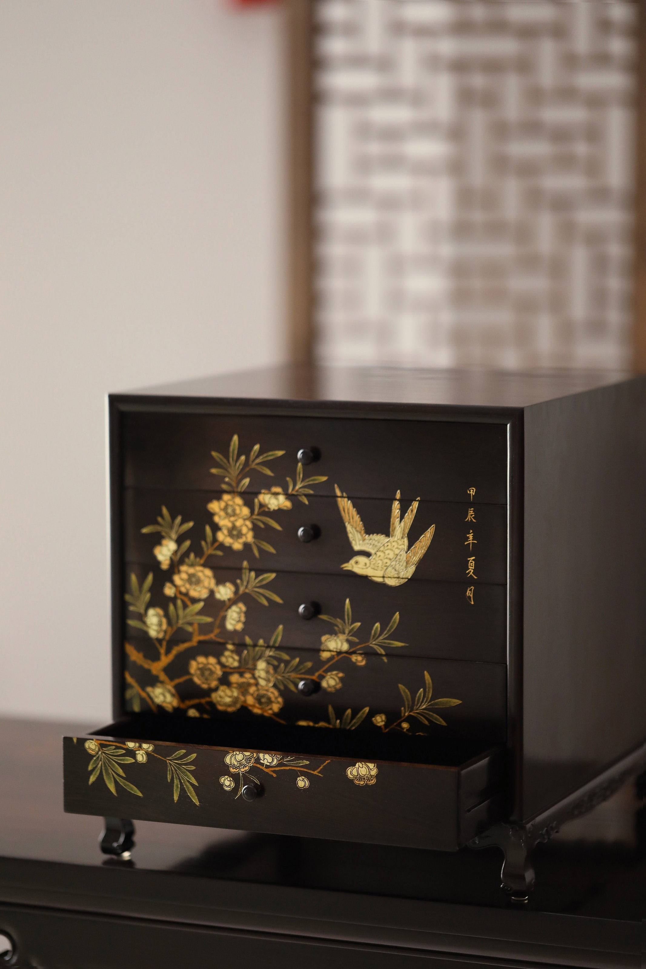 Gold piled high, joy on eyebrows / Wealth and good fortune on the table, five cups of tea on the sideboard