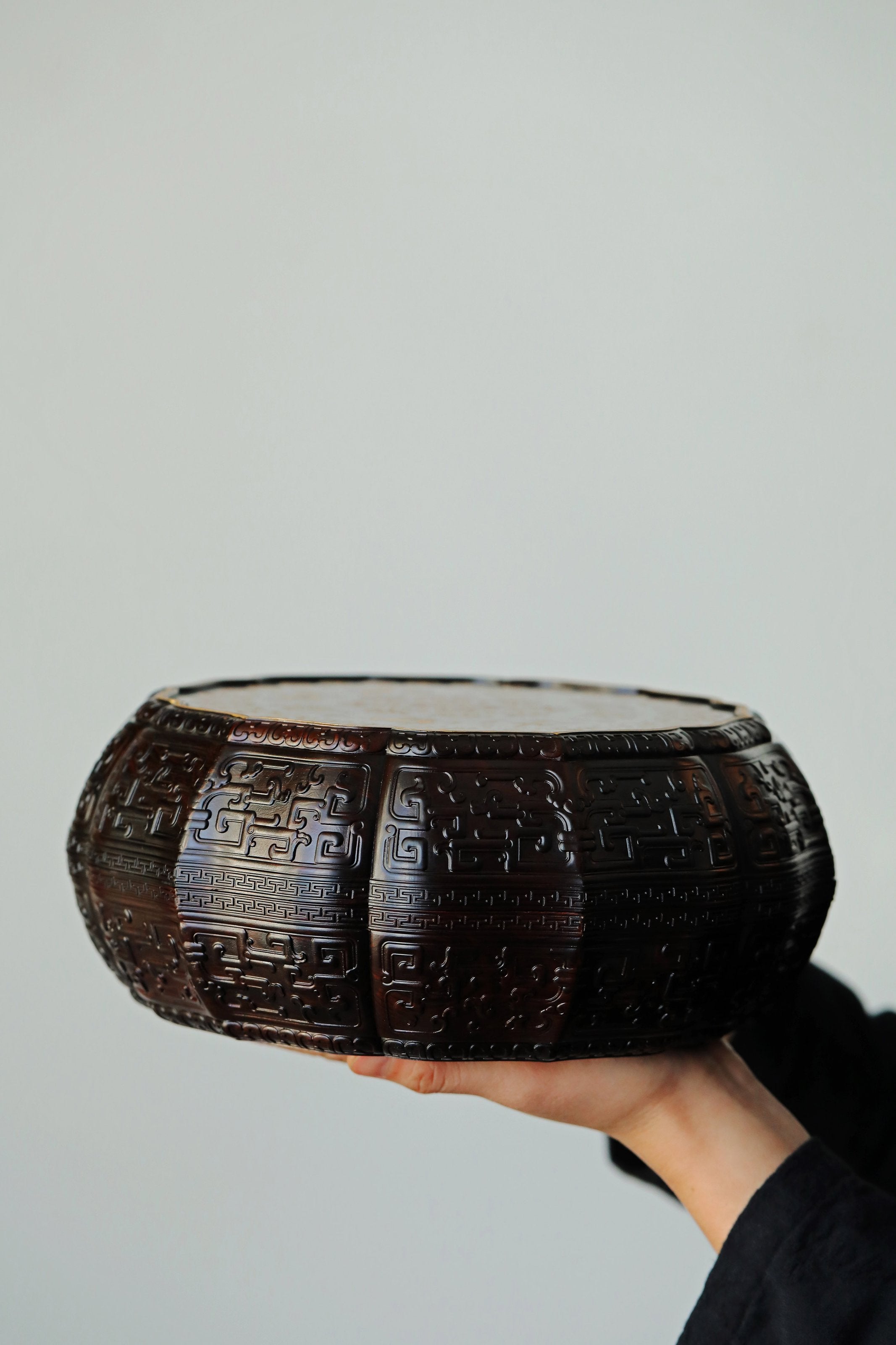 Purple sandalwood twelve-cornered fruit box with gilded Eight Immortals design and sunflower-shaped opening.