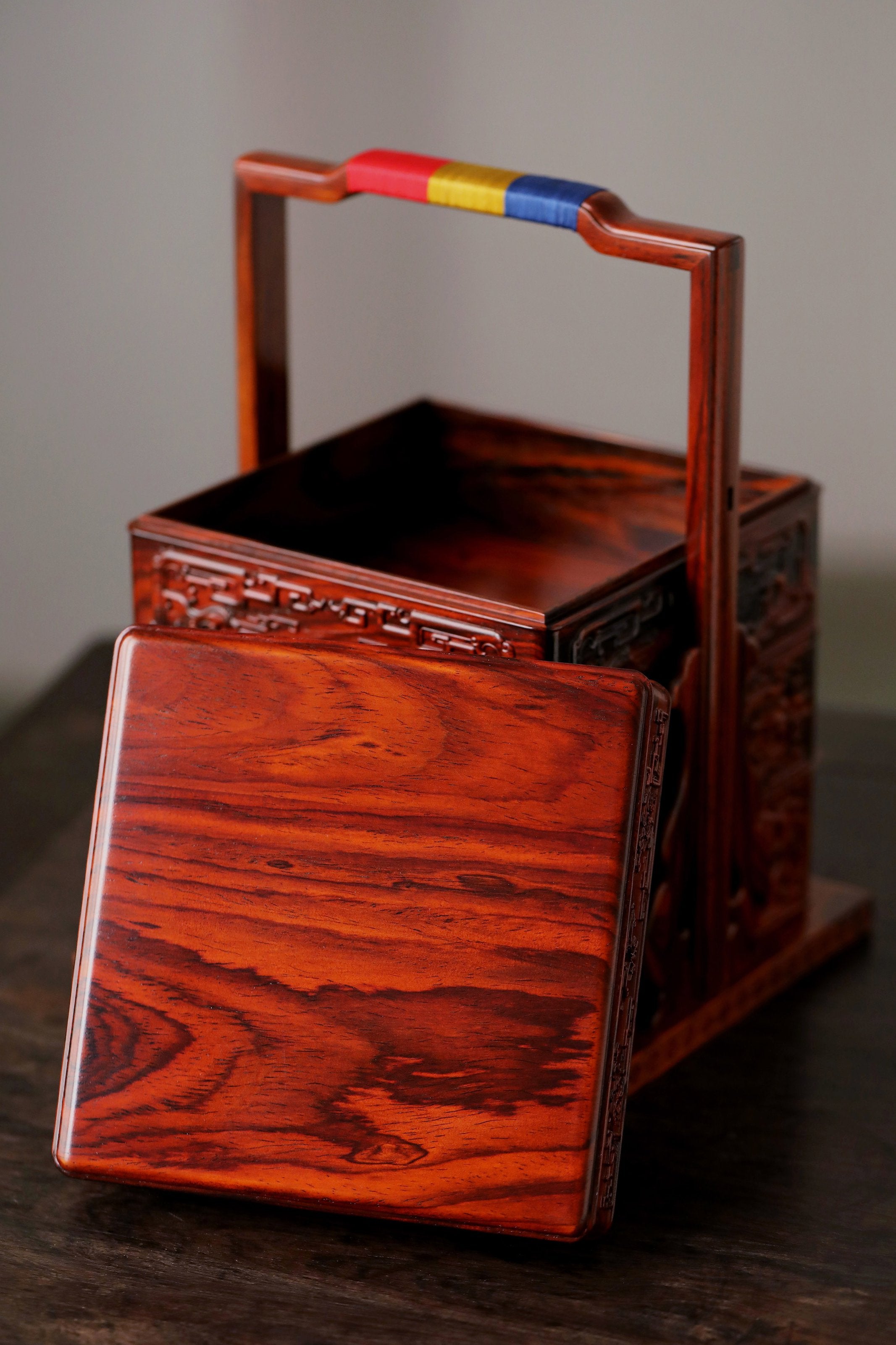 Rosewood square box with carved dragon and phoenix patterns