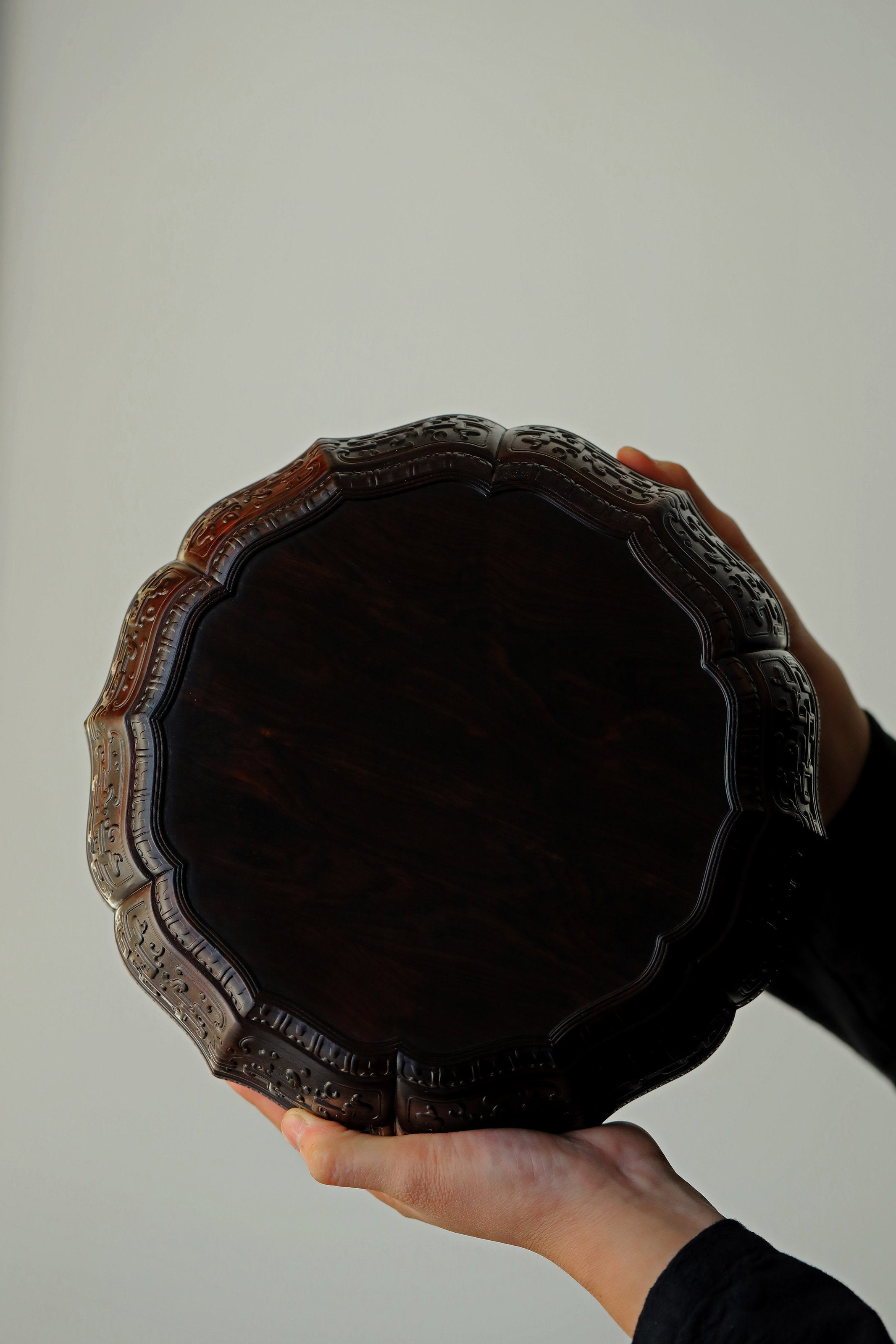 Purple sandalwood twelve-cornered fruit box with gilded Eight Immortals design and sunflower-shaped opening.