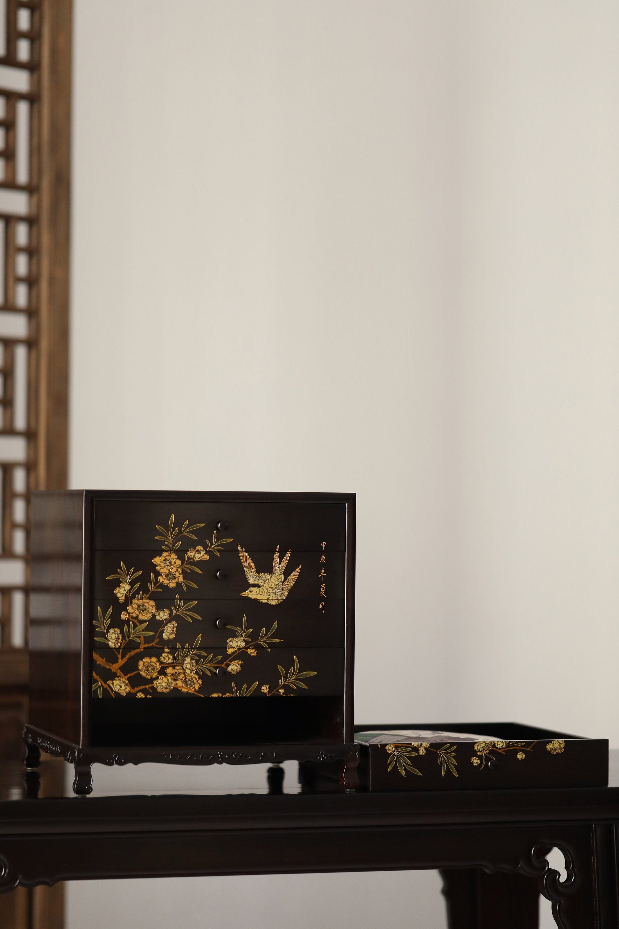 Gold piled high, joy on eyebrows / Wealth and good fortune on the table, five cups of tea on the sideboard