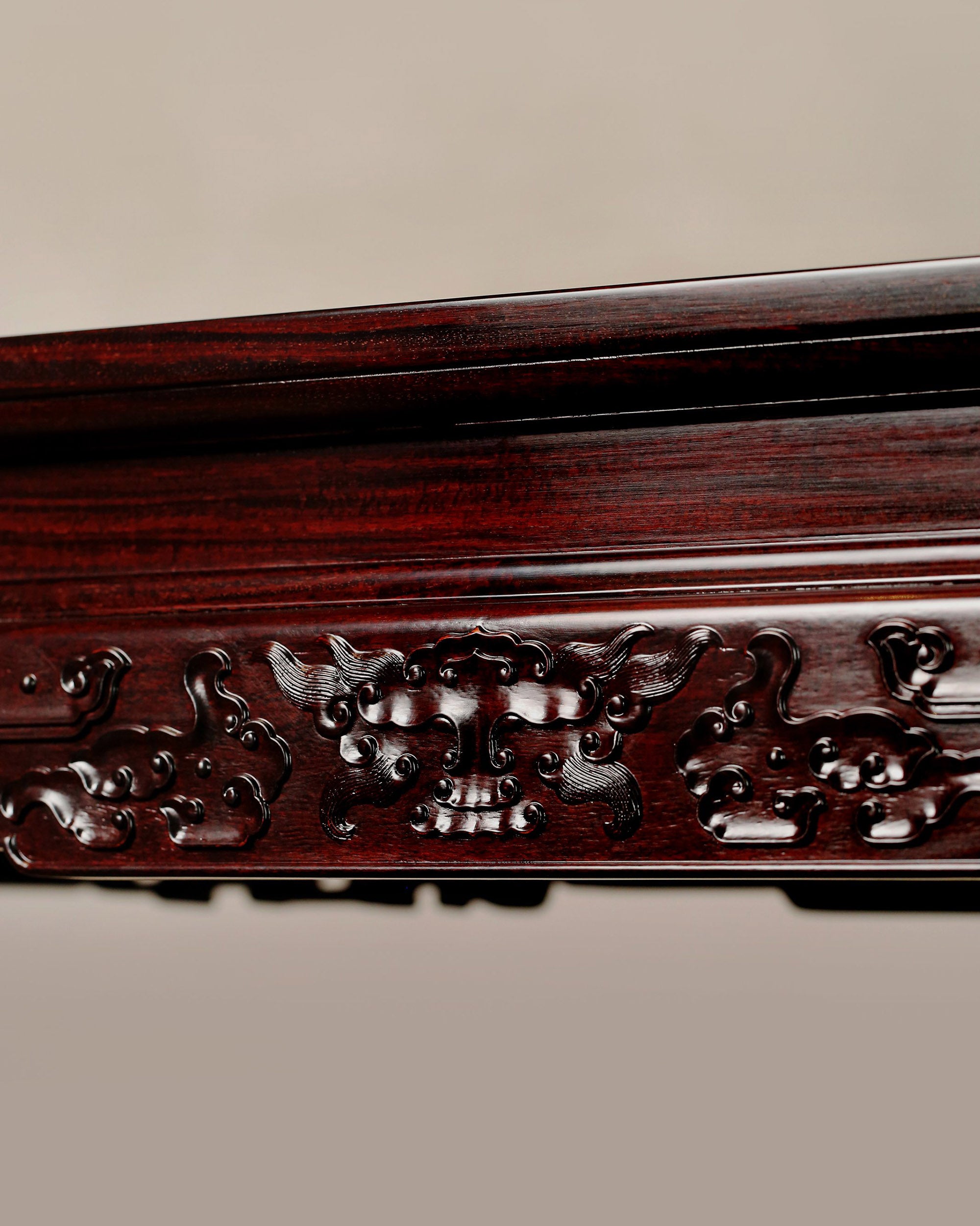 A large rosewood table with taotie design, made for the Qing Dynasty imperial court.