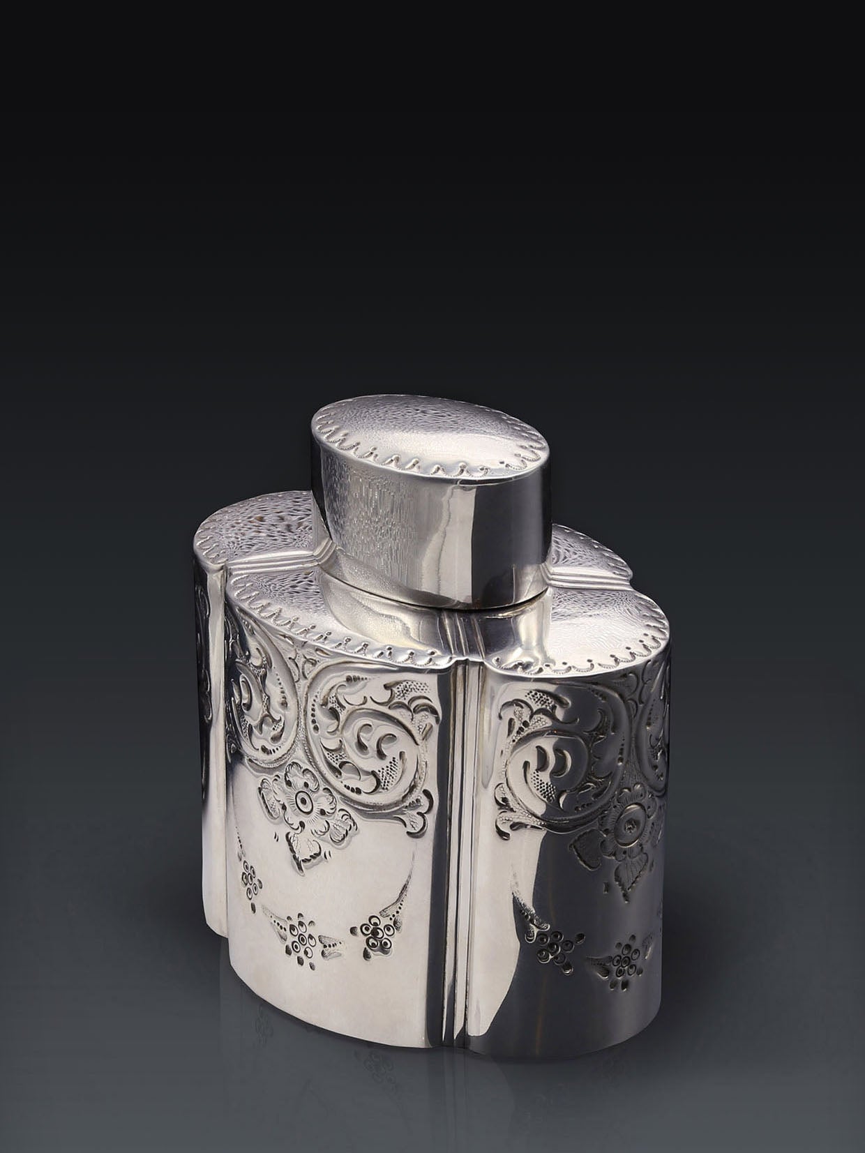 Atkin made sterling silver tea caddies in Sheffield in 1895.