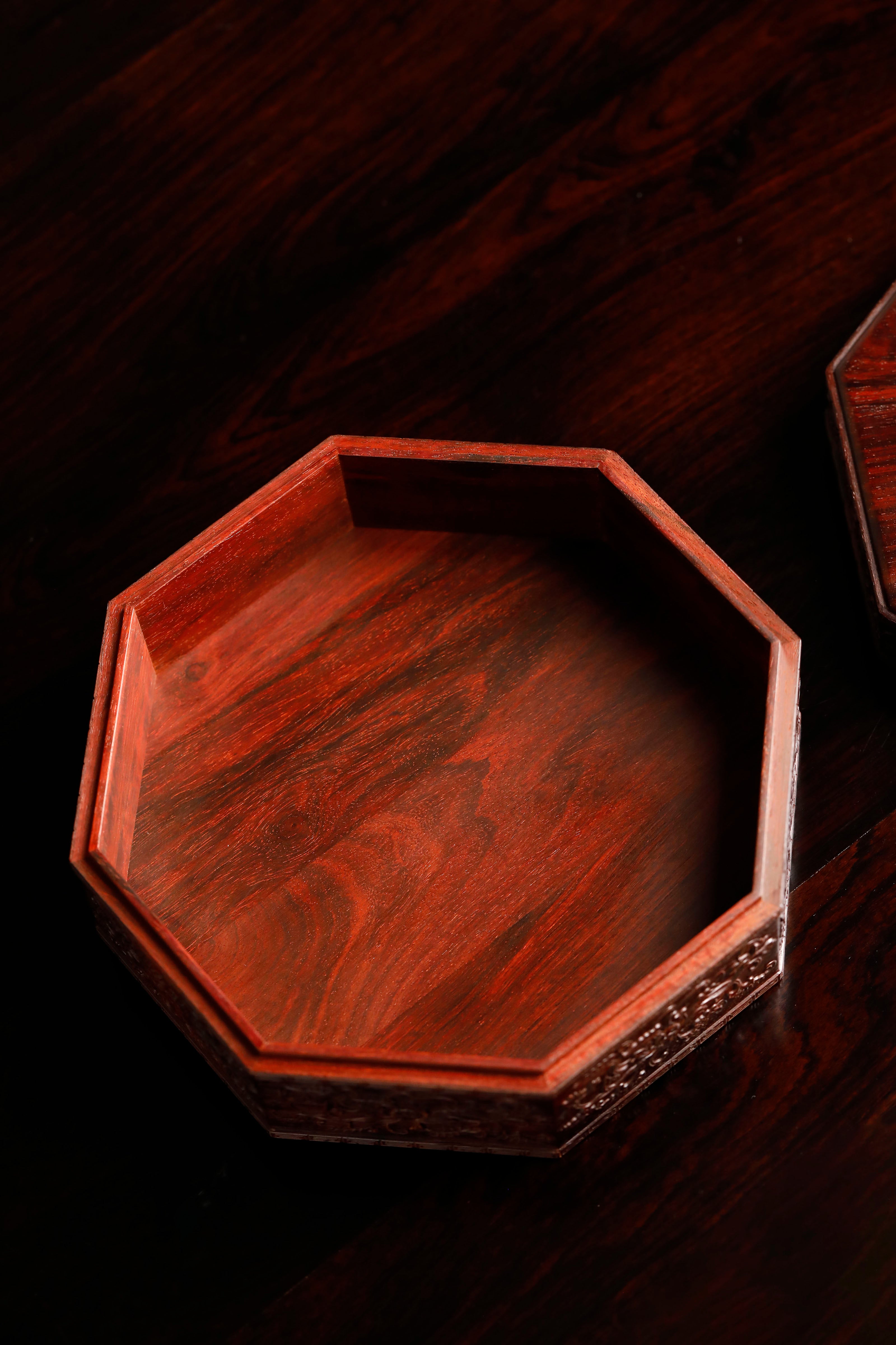 Small-leaf sandalwood octagonal box inlaid with precious stones, symbolizing joy and laughter.