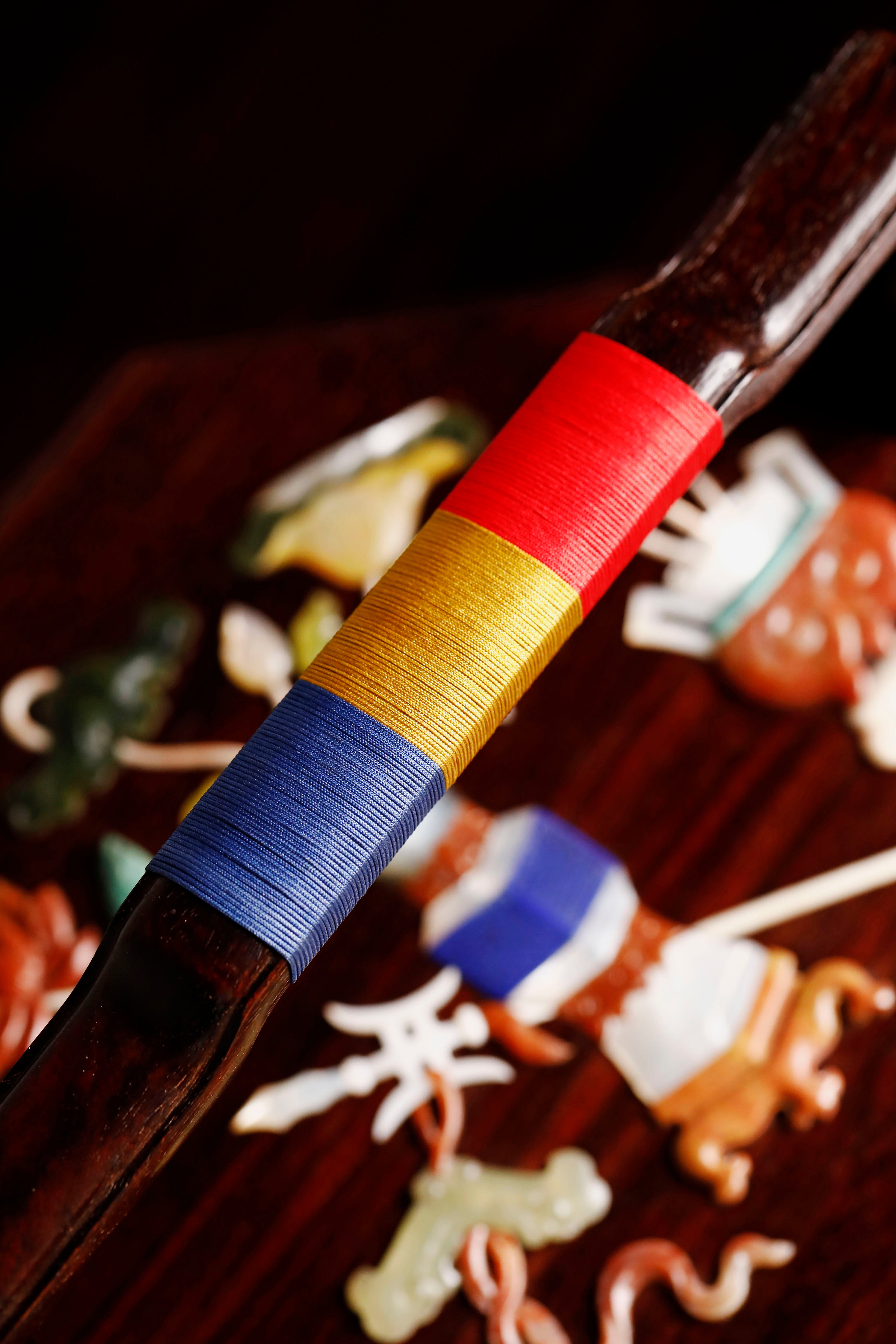 Small-leaf sandalwood octagonal box inlaid with precious stones, symbolizing joy and laughter.