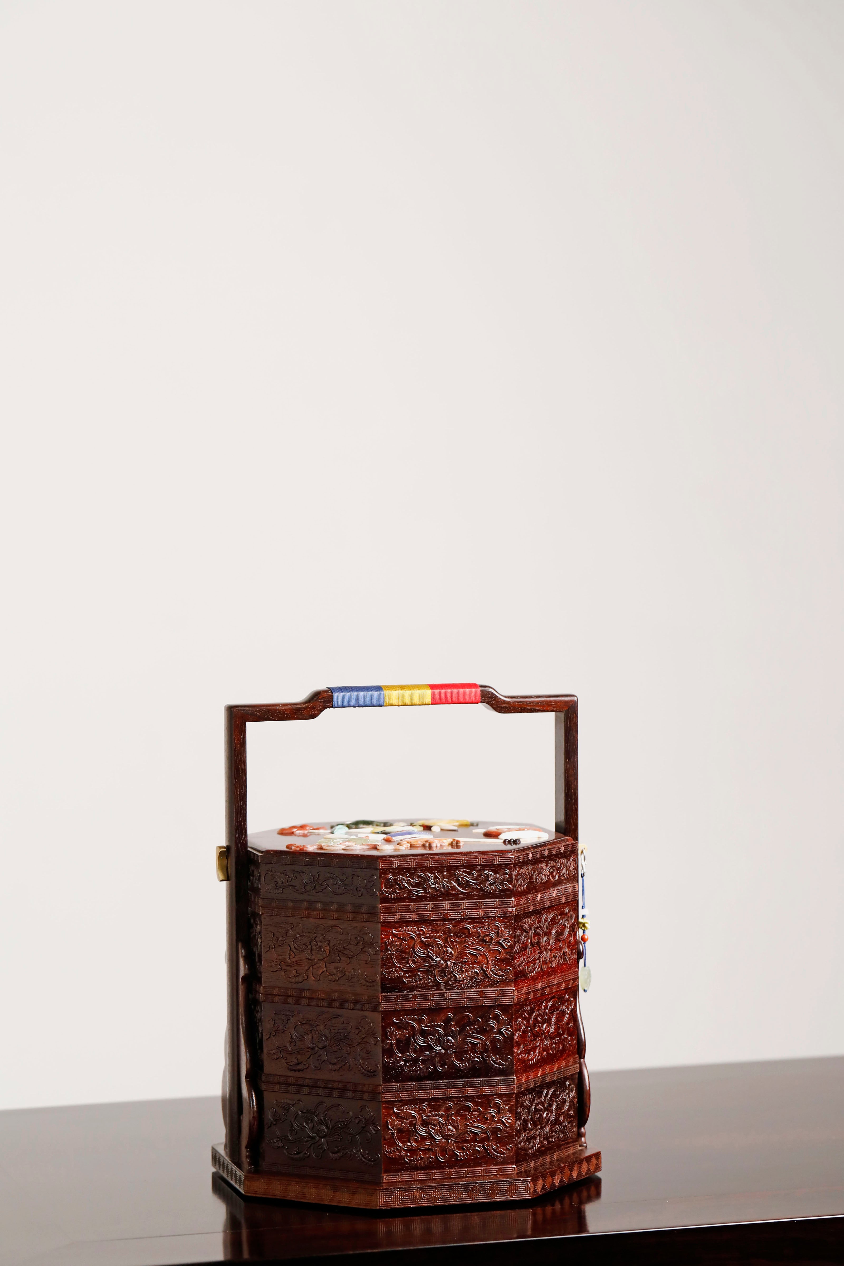 Small-leaf sandalwood octagonal box inlaid with precious stones, symbolizing joy and laughter.