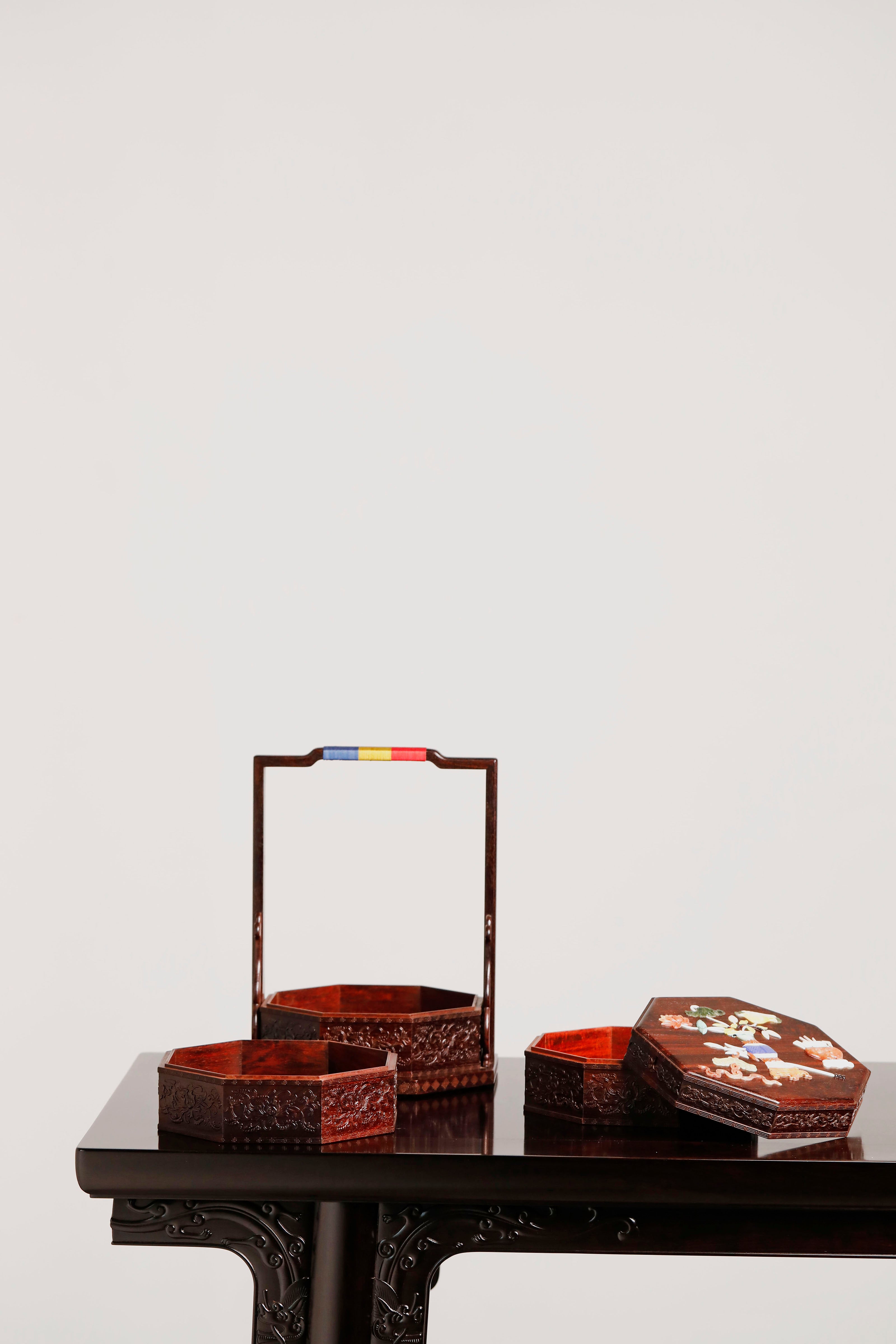 Small-leaf sandalwood octagonal box inlaid with precious stones, symbolizing joy and laughter.