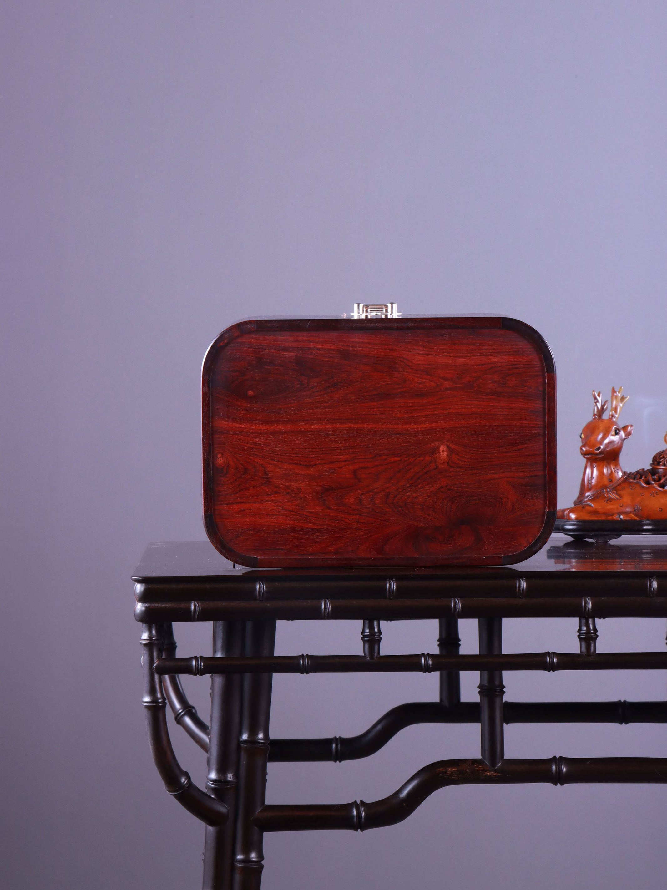 White Lotus Leaning on Kingfisher Tea Box