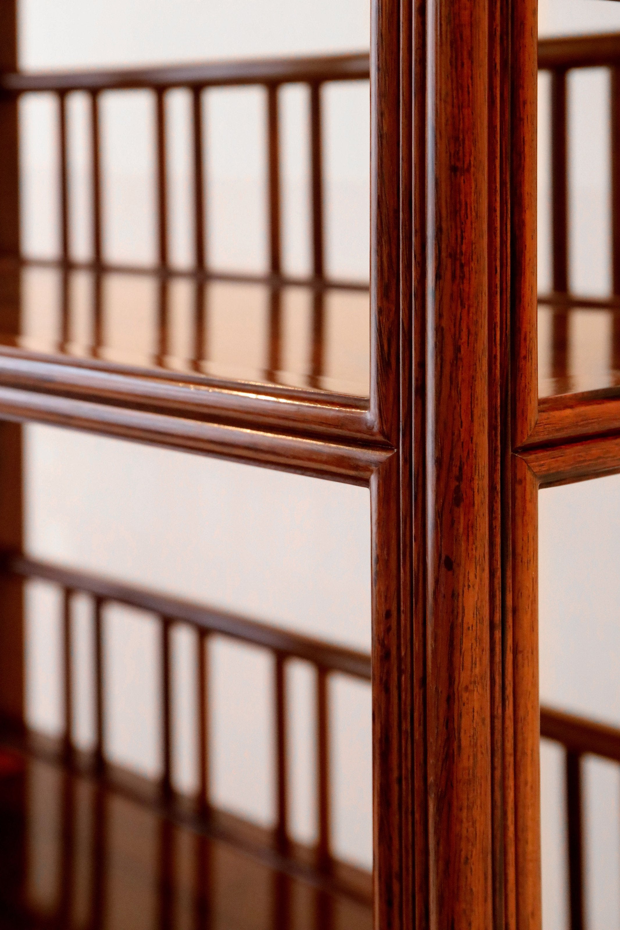White rosewood branches sparsely sprout from the bottom of the scholar's desk.