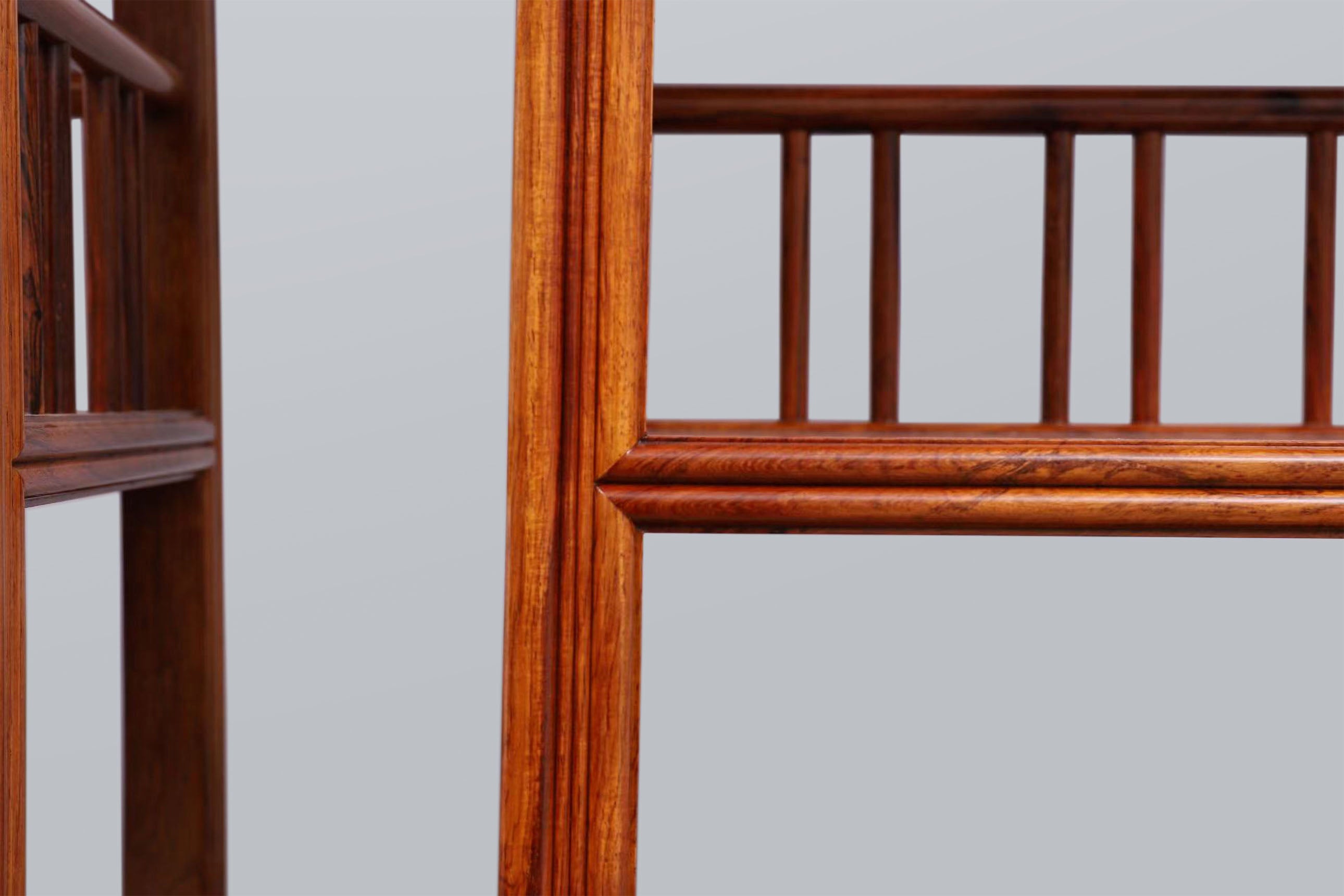 White rosewood branches sparsely sprout from the bottom of the scholar's desk.