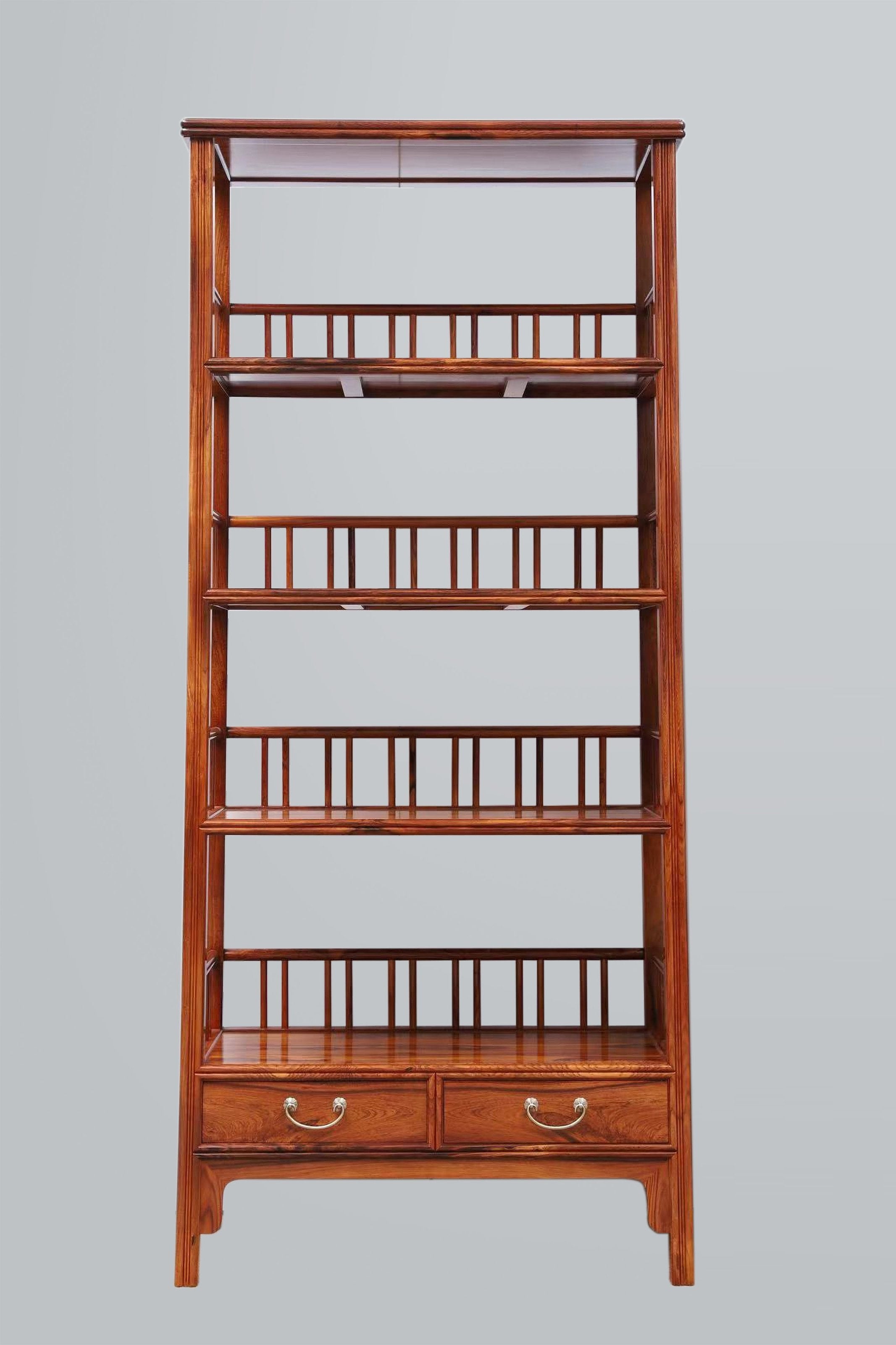 White rosewood branches sparsely sprout from the bottom of the scholar's desk.