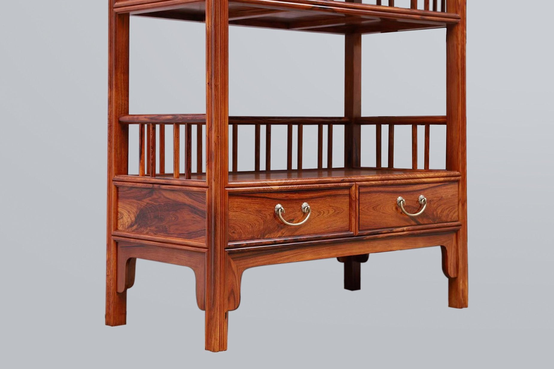 White rosewood branches sparsely sprout from the bottom of the scholar's desk.