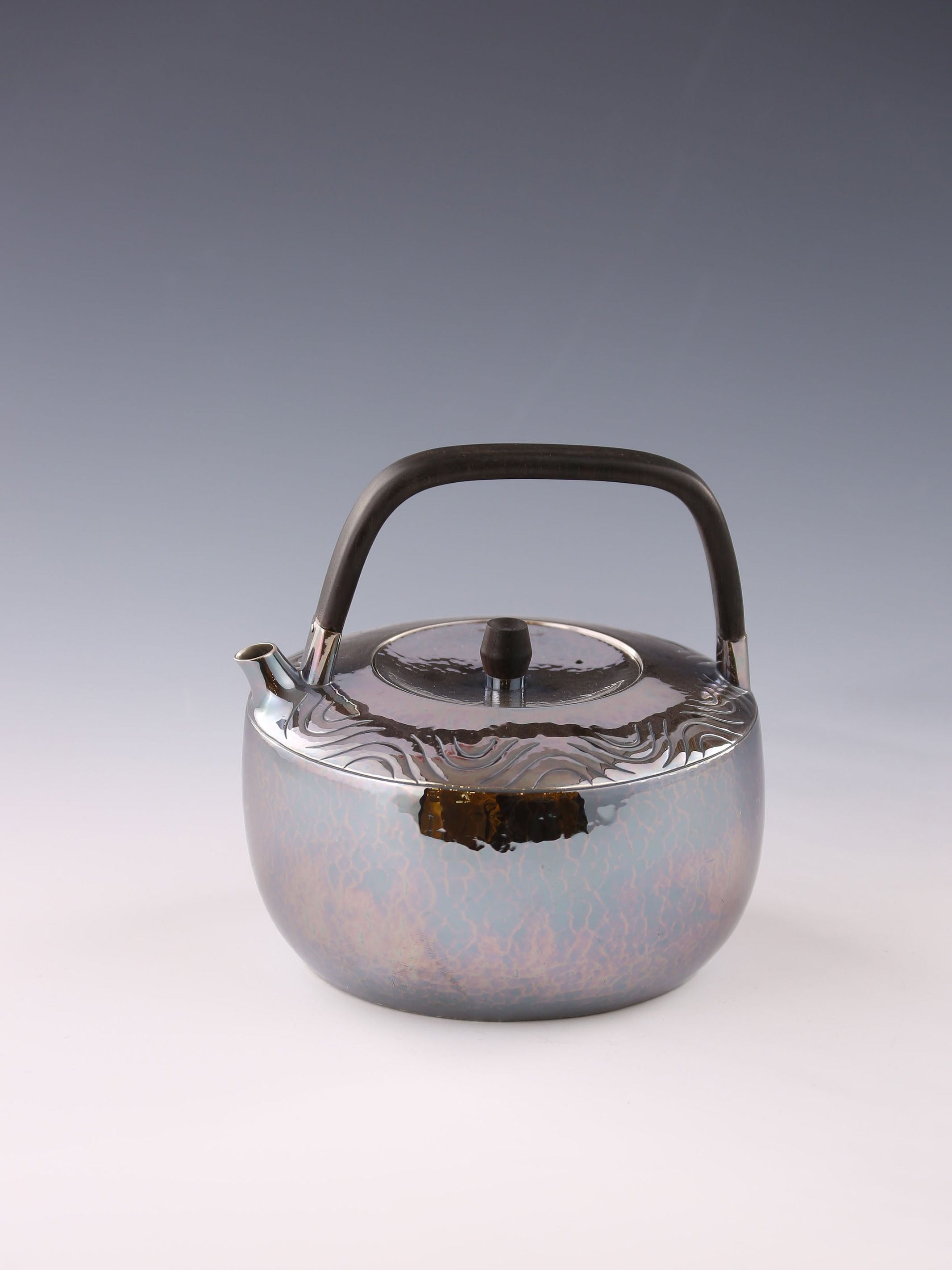 Wavy wooden handle silver teapot