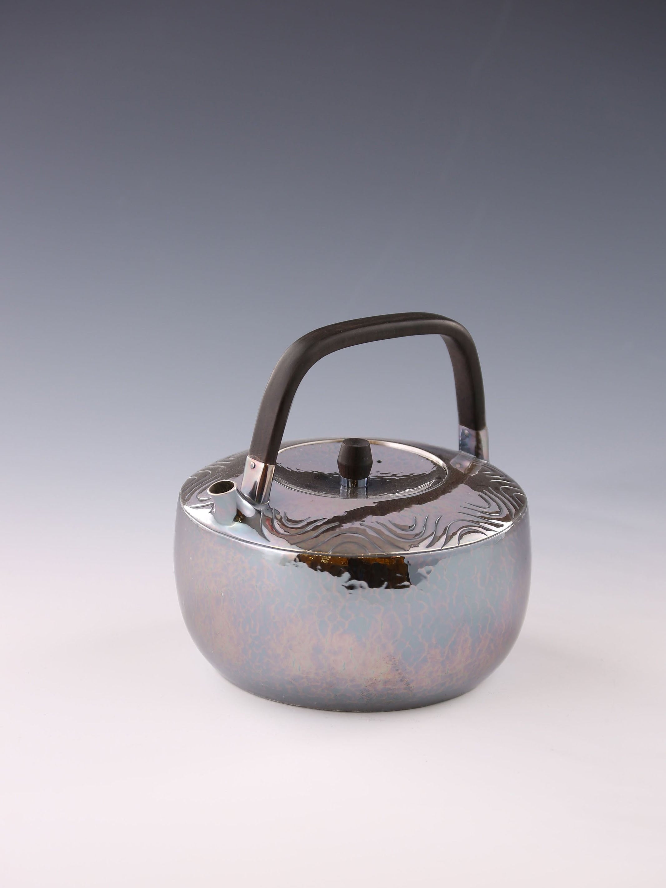 Wavy wooden handle silver teapot