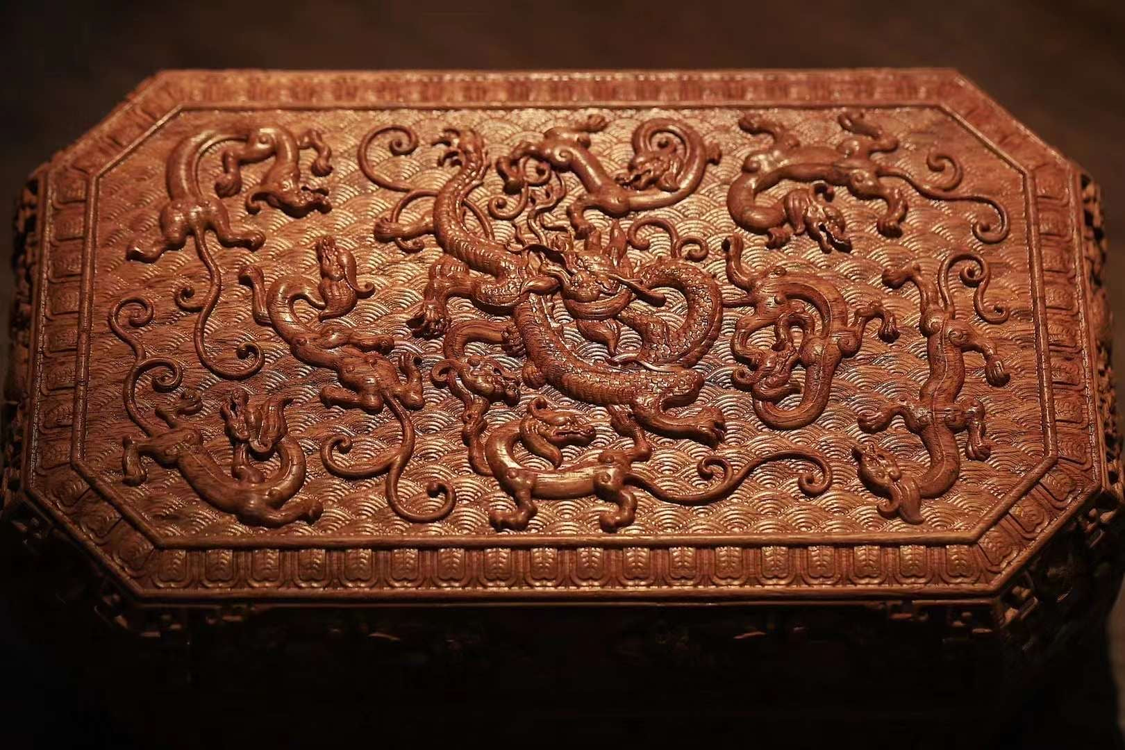 Tea box with full carving of lychee, butterfly, and dragon patterns