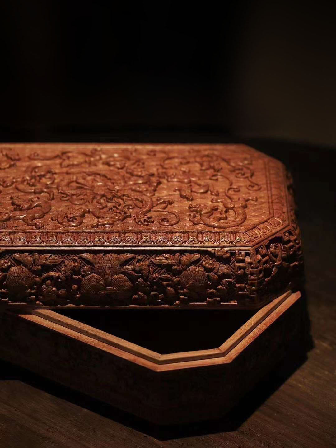 Tea box with full carving of lychee, butterfly, and dragon patterns