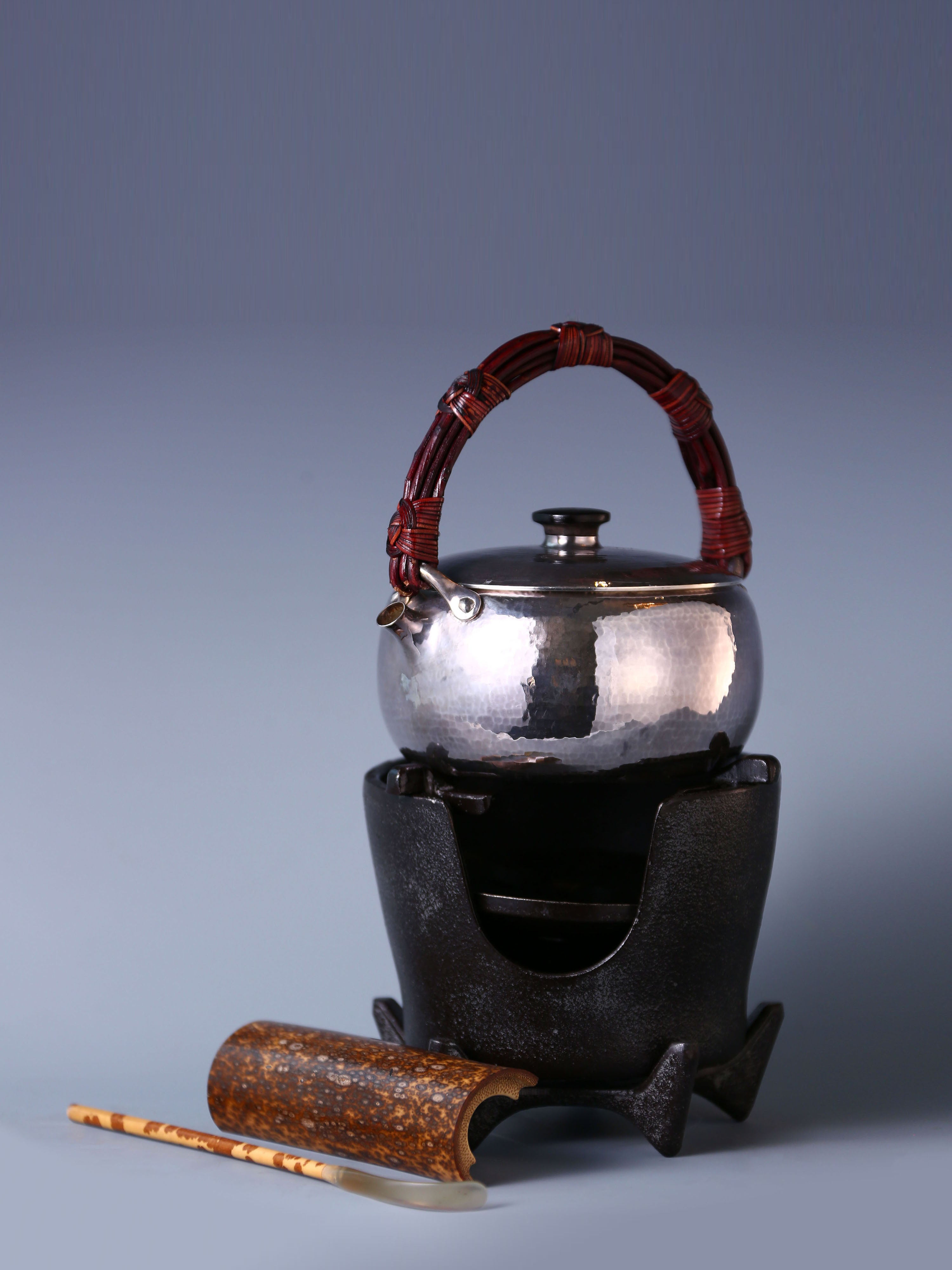 Large rattan spout, silver kettle, cast iron tea stove