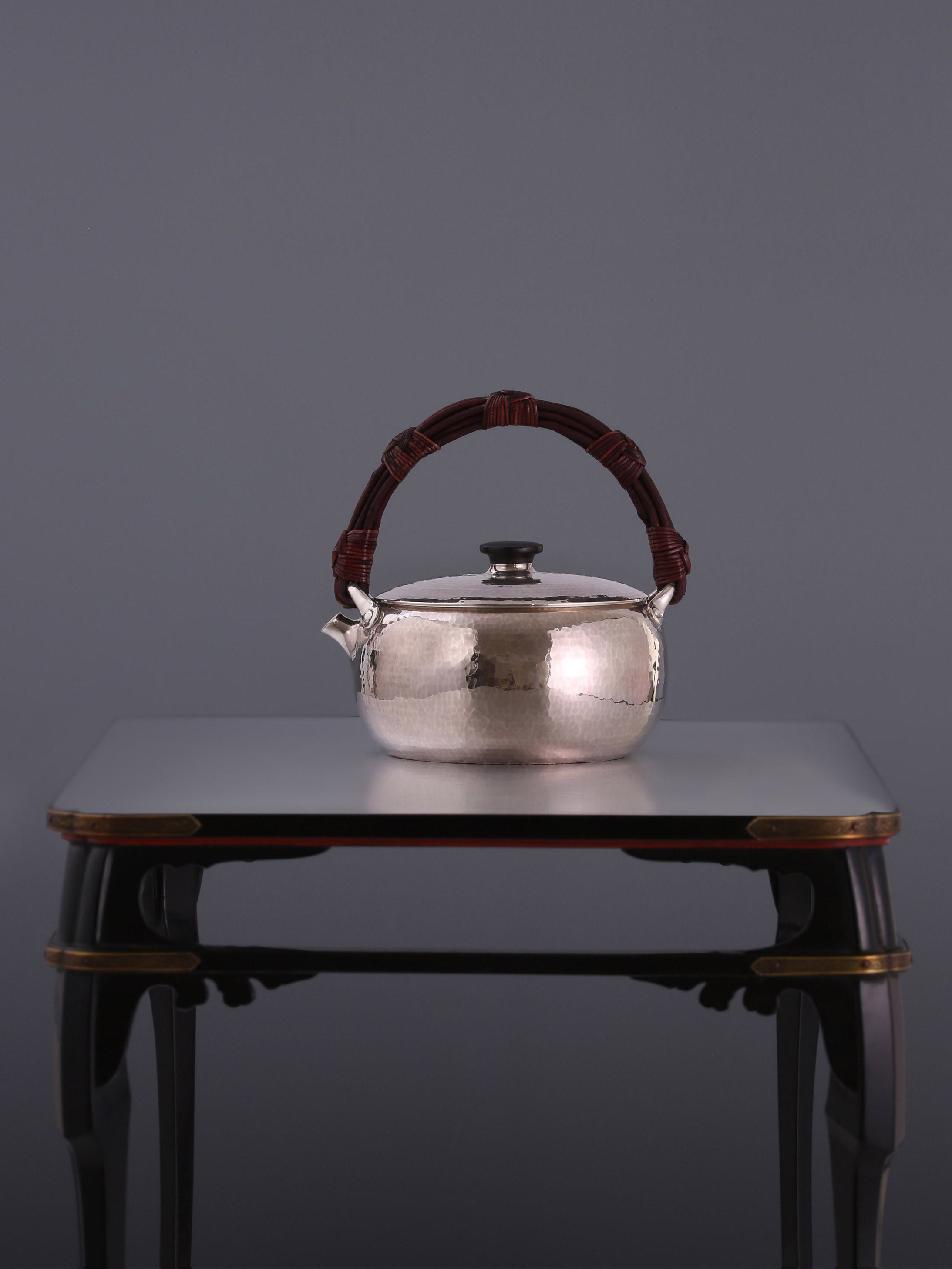 Large rattan spout, silver kettle, cast iron tea stove