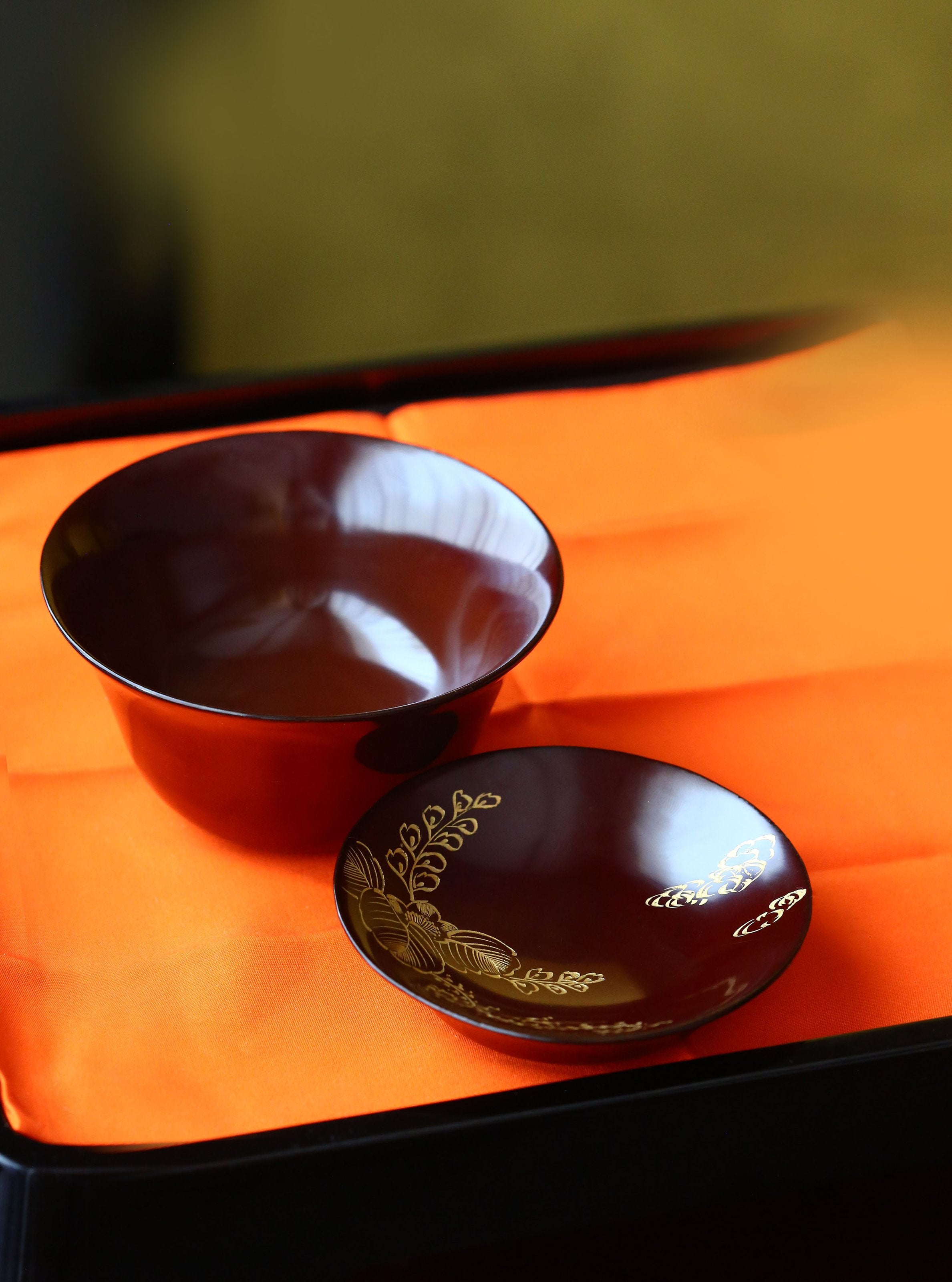 Two lacquered and gold-plated covered bowls