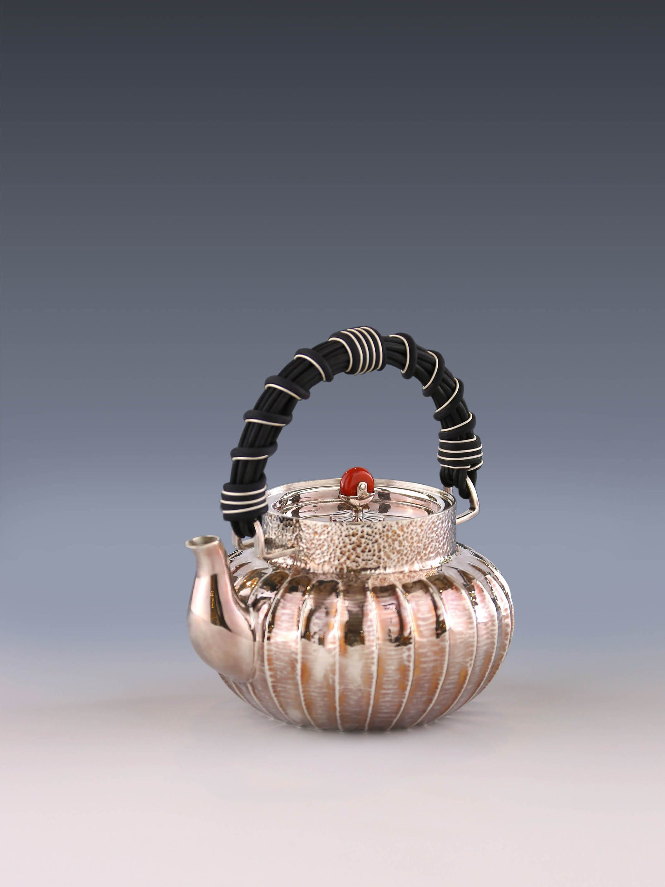 Lantern-shaped wicker handle sterling silver teapot