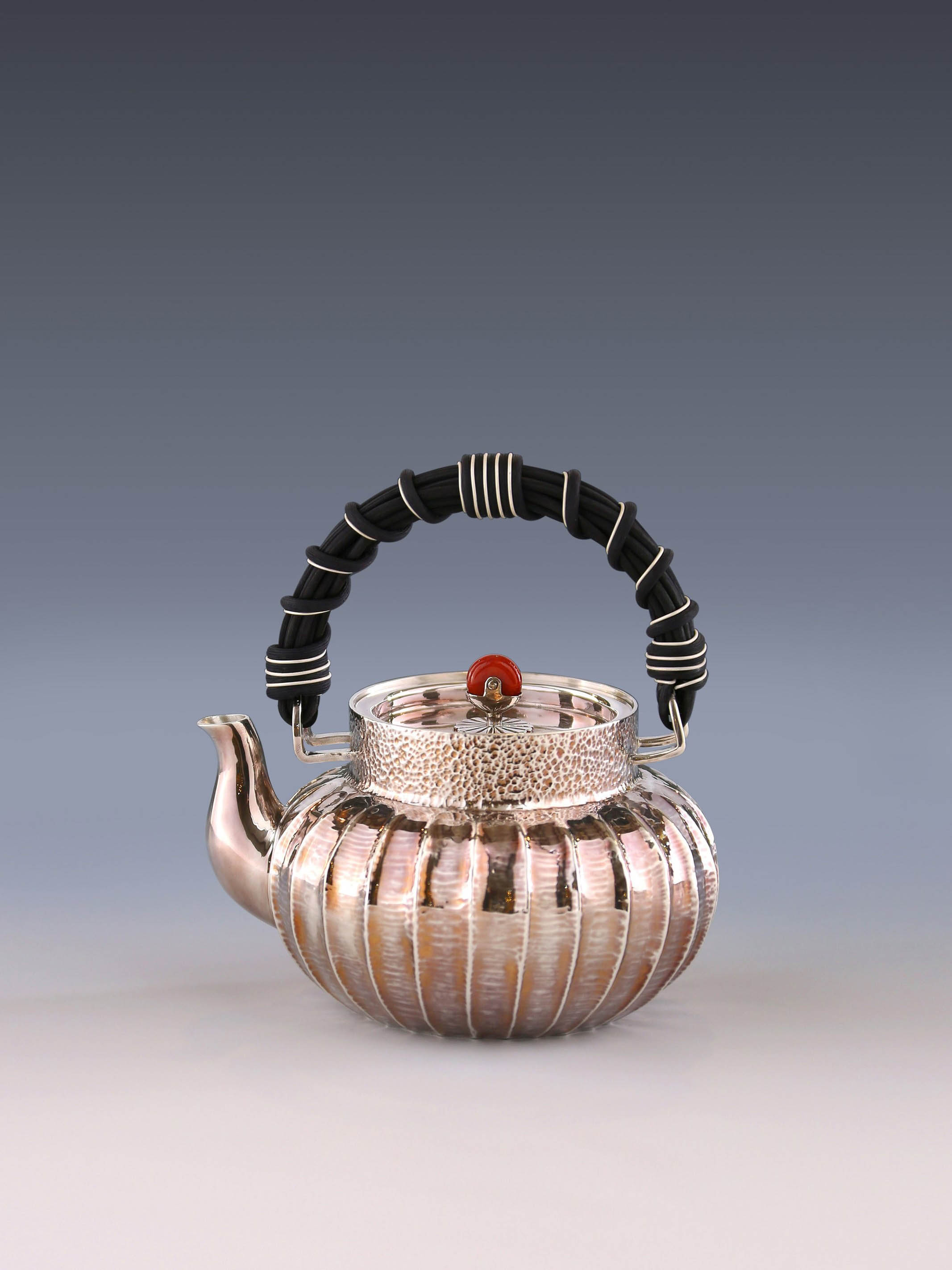 Lantern-shaped wicker handle sterling silver teapot
