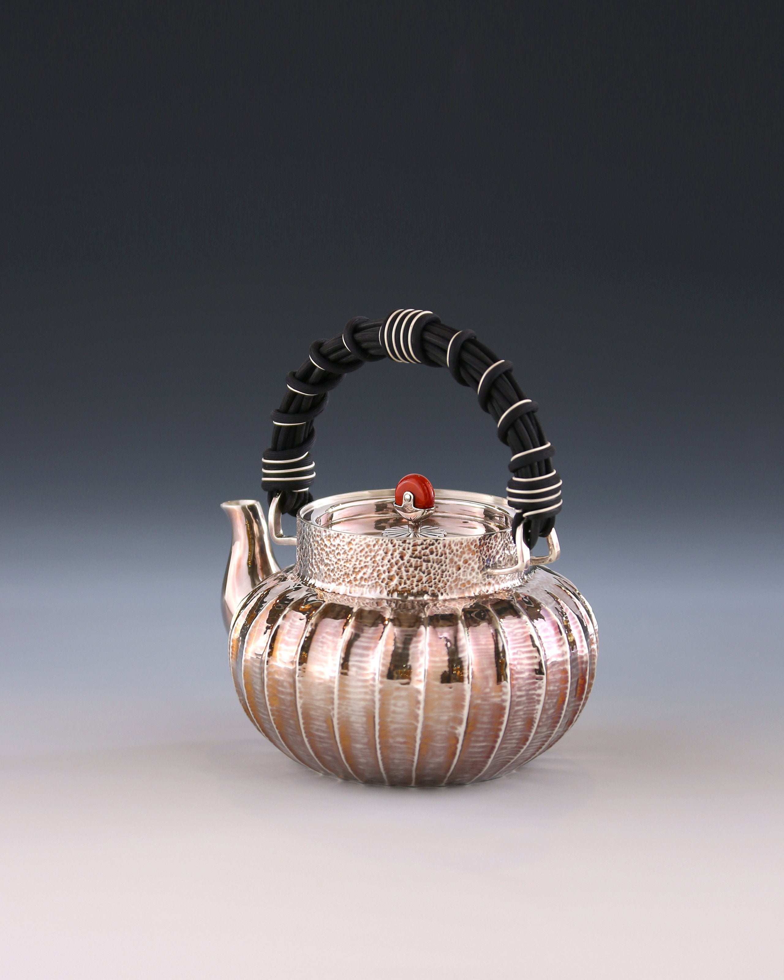 Lantern-shaped wicker handle sterling silver teapot
