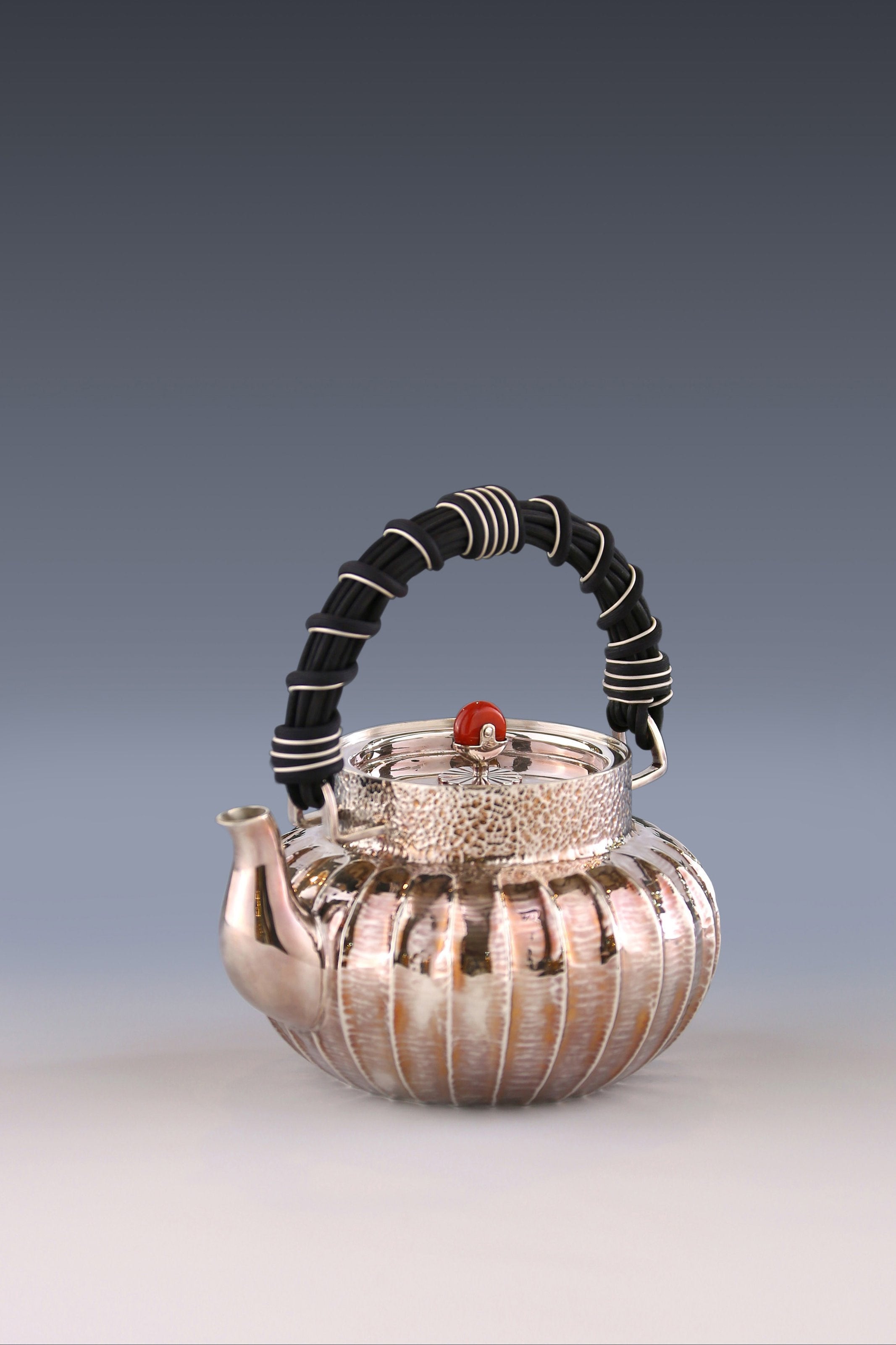 Lantern-shaped wicker handle sterling silver teapot