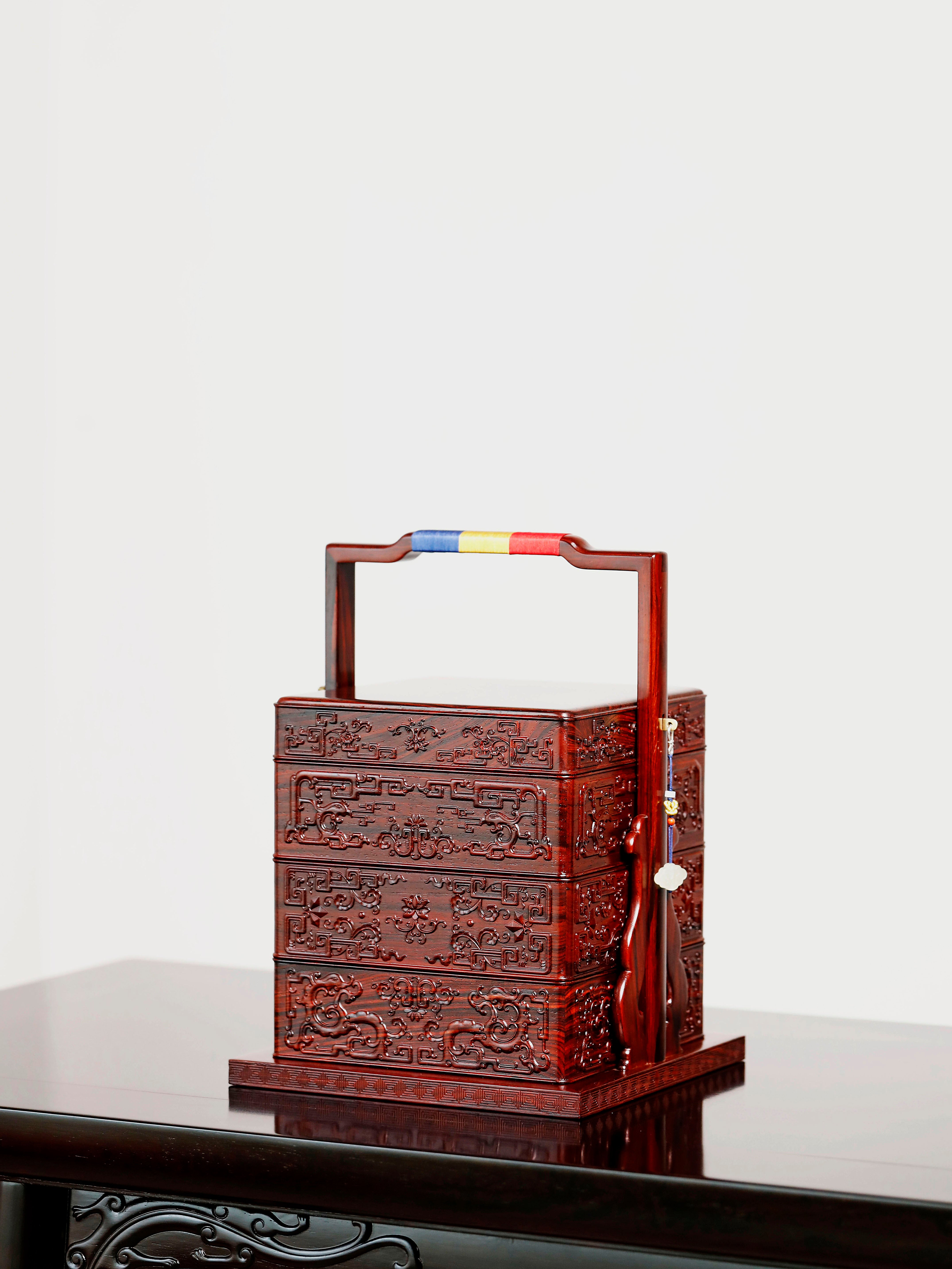 Rosewood square box with carved dragon and phoenix patterns
