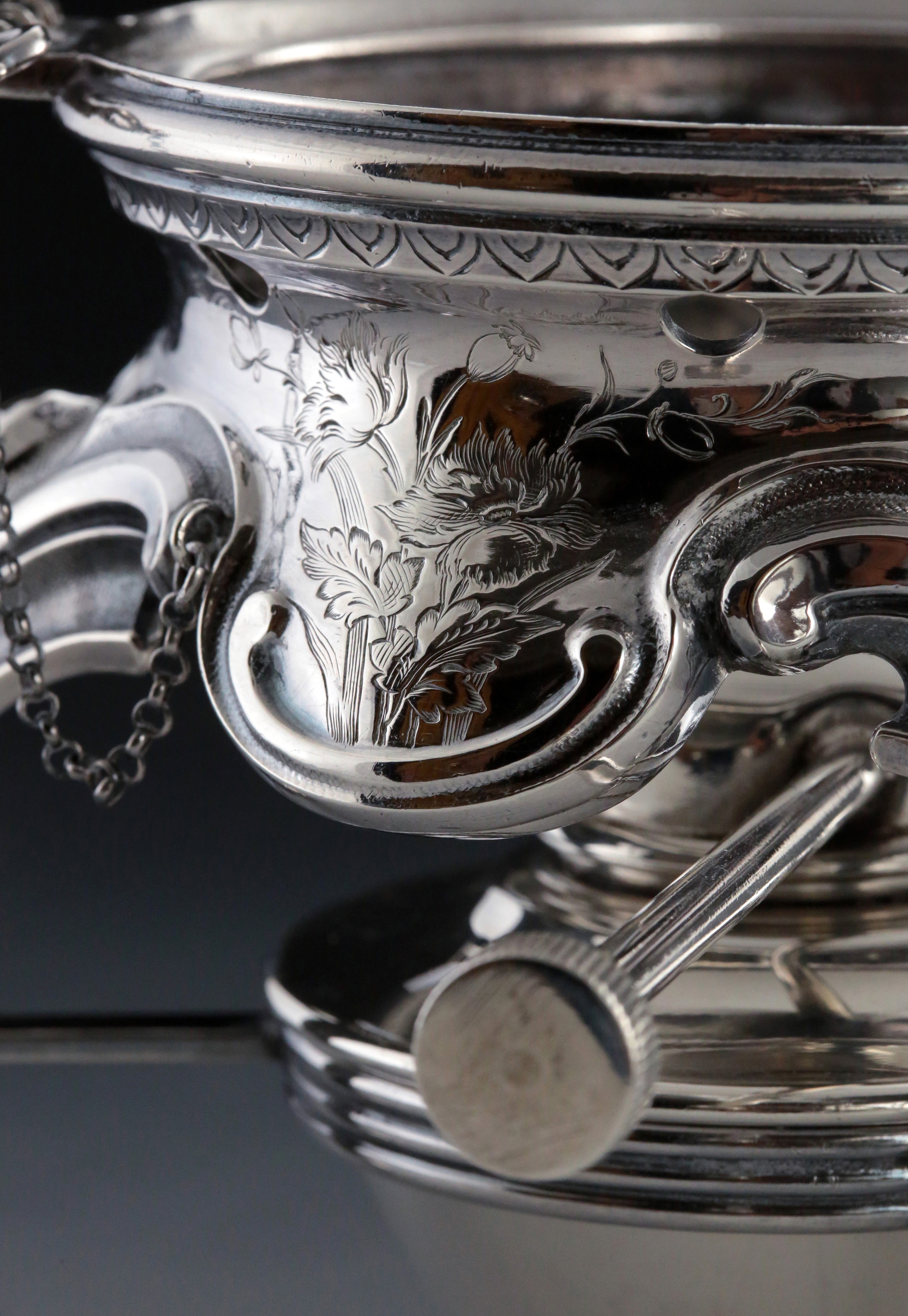 A set of 19th-century French sterling silver tea set featuring a swirling palm leaf pattern.