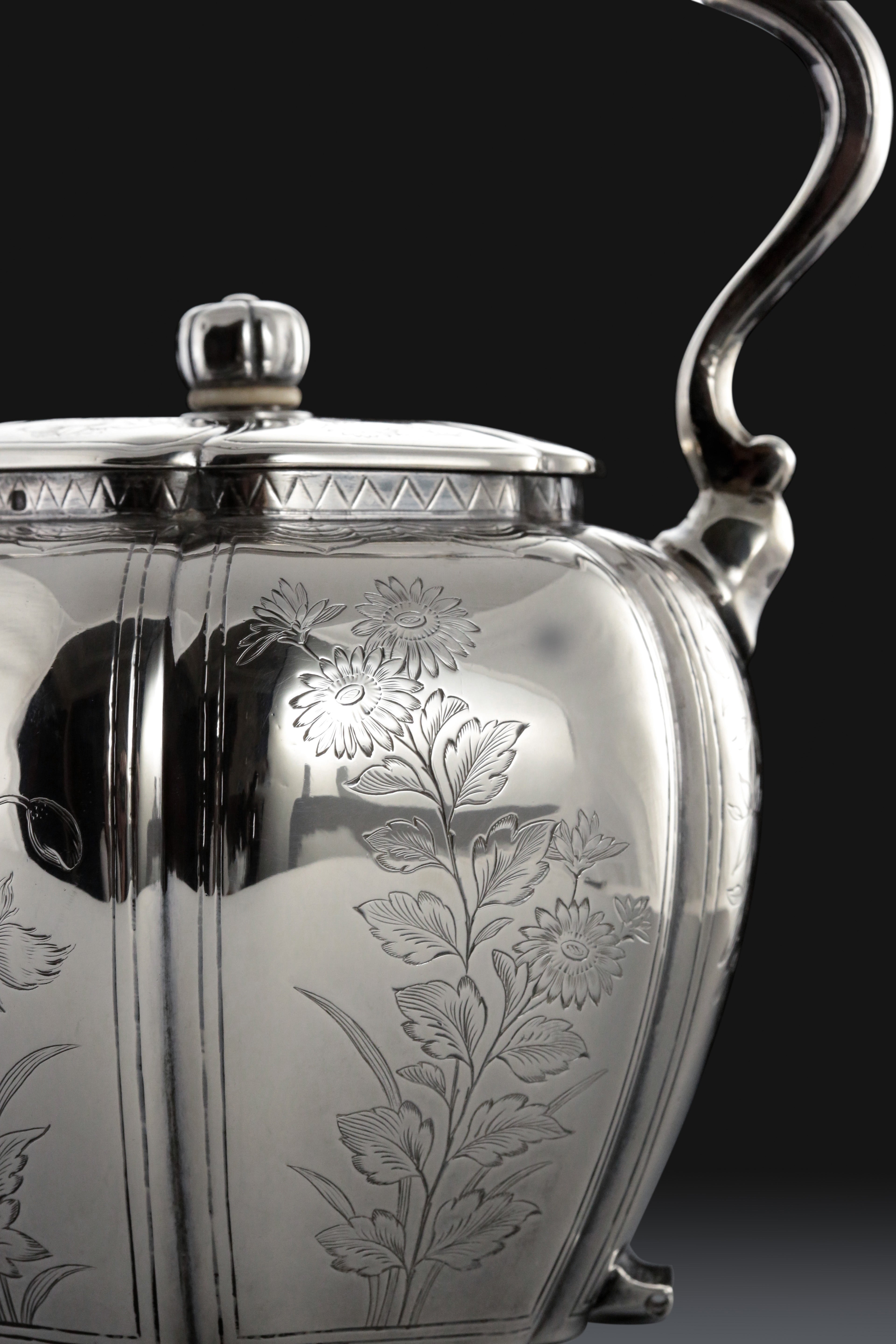 A set of 19th-century French sterling silver tea set featuring a swirling palm leaf pattern.