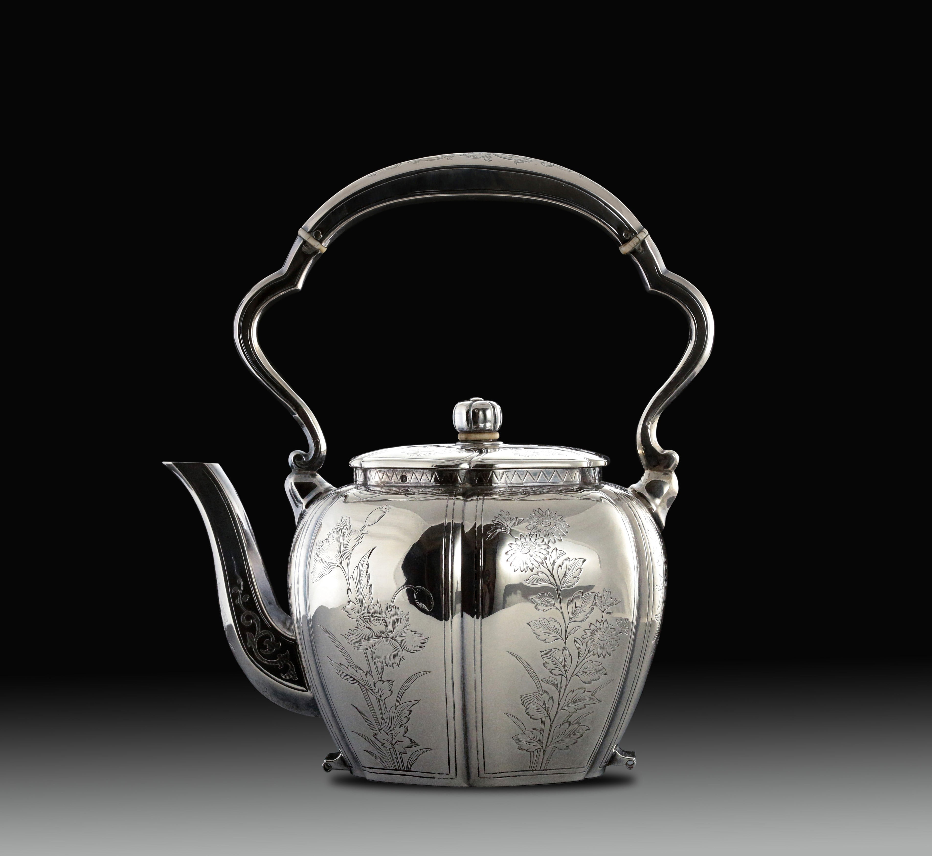 A set of 19th-century French sterling silver tea set featuring a swirling palm leaf pattern.