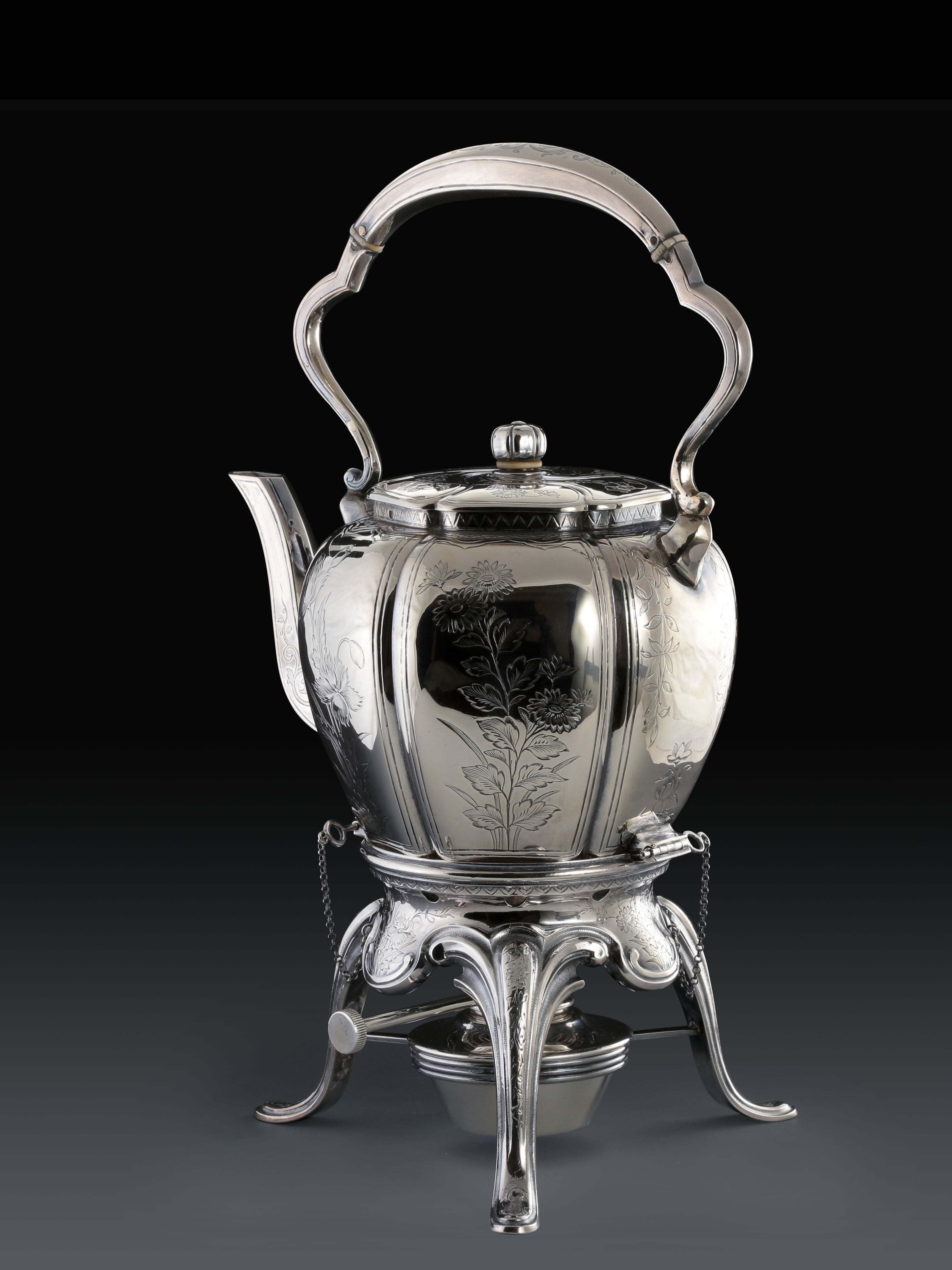 A set of 19th-century French sterling silver tea set featuring a swirling palm leaf pattern.