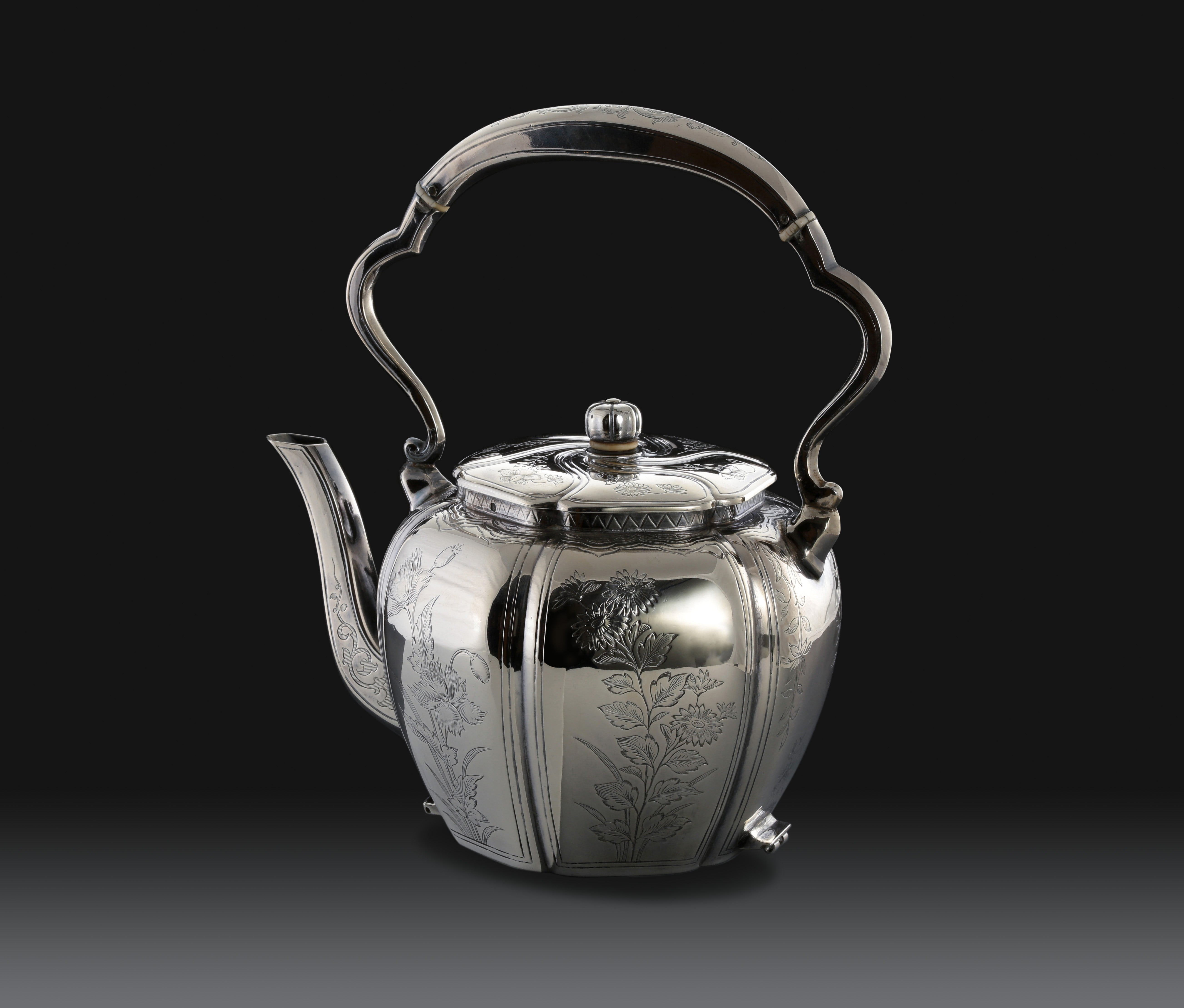 A set of 19th-century French sterling silver tea set featuring a swirling palm leaf pattern.