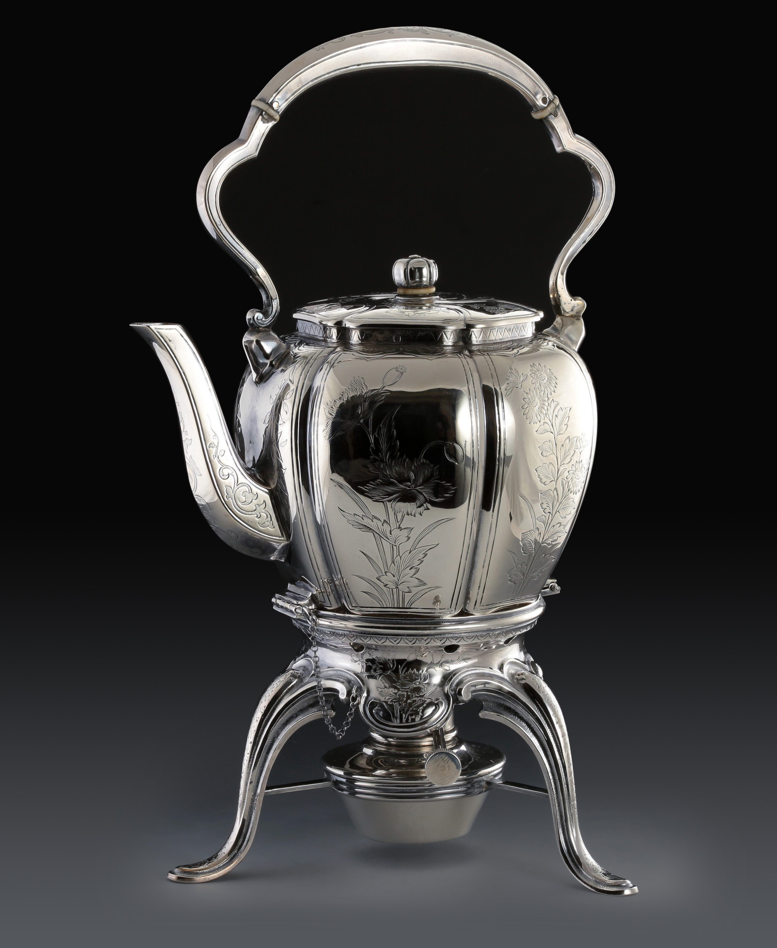 A set of 19th-century French sterling silver tea set featuring a swirling palm leaf pattern.