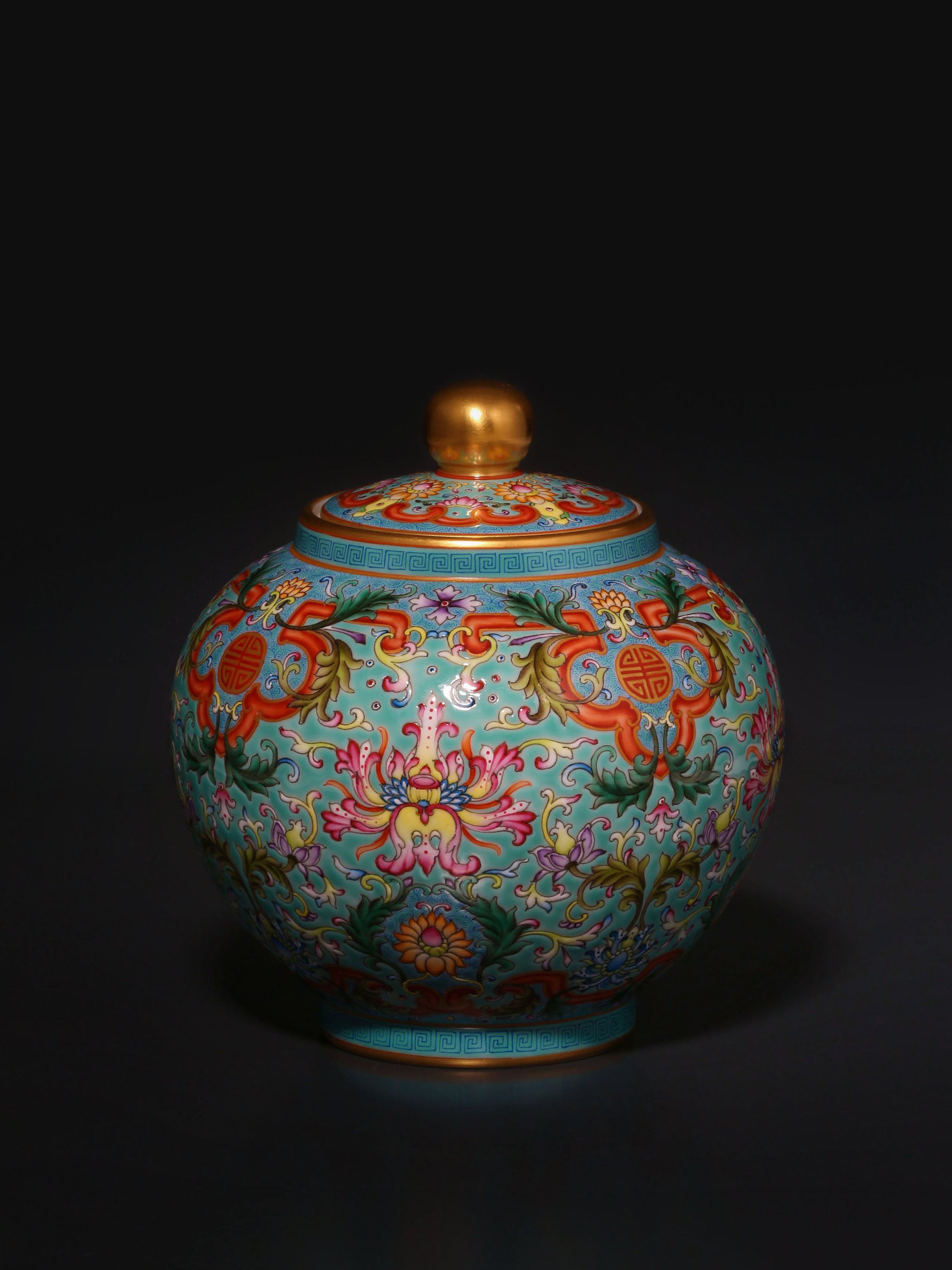 Enamel-painted lotus flower pattern, iron-red ruyi frame, tea canister