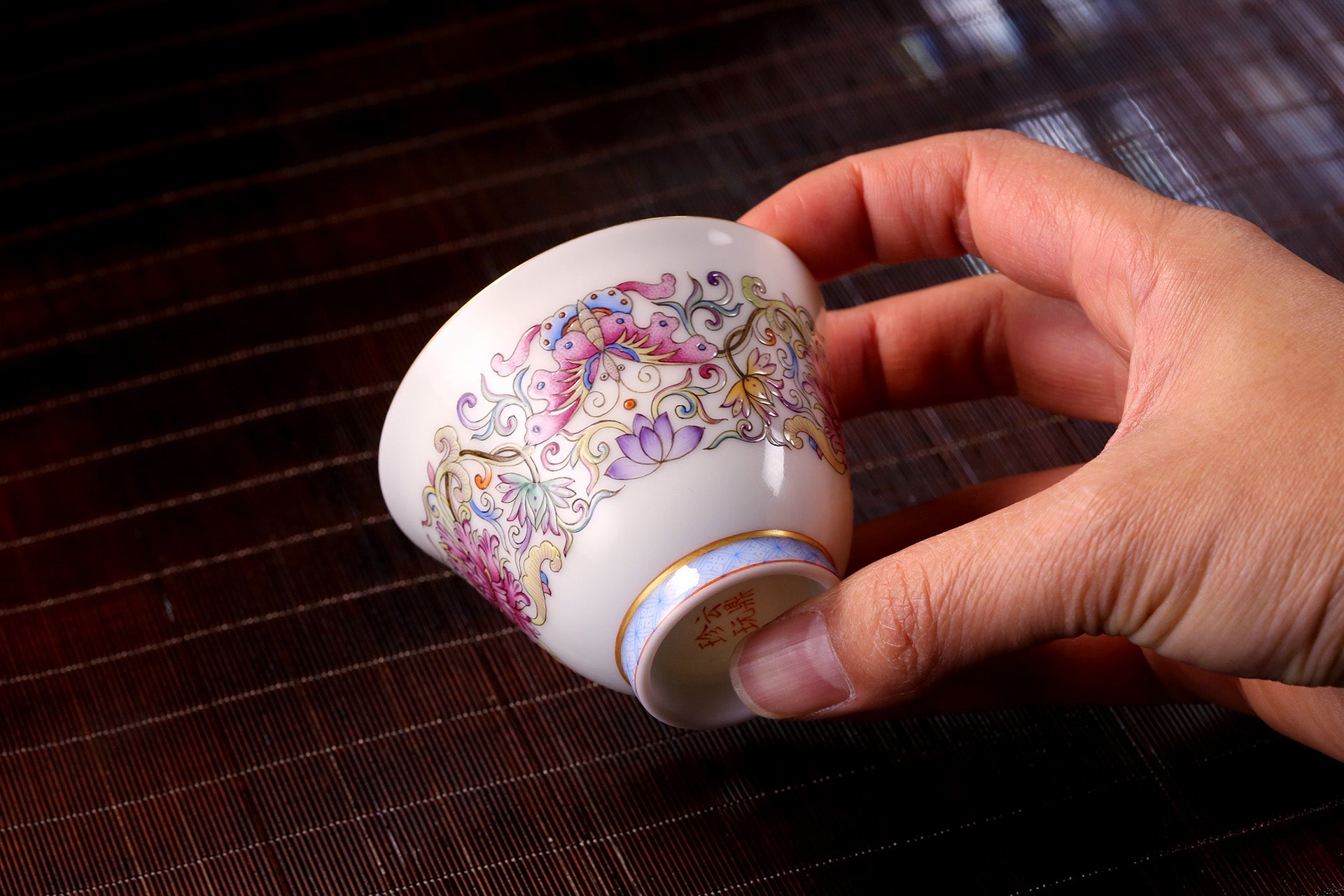 Enamel-painted cup with overlapping floral patterns