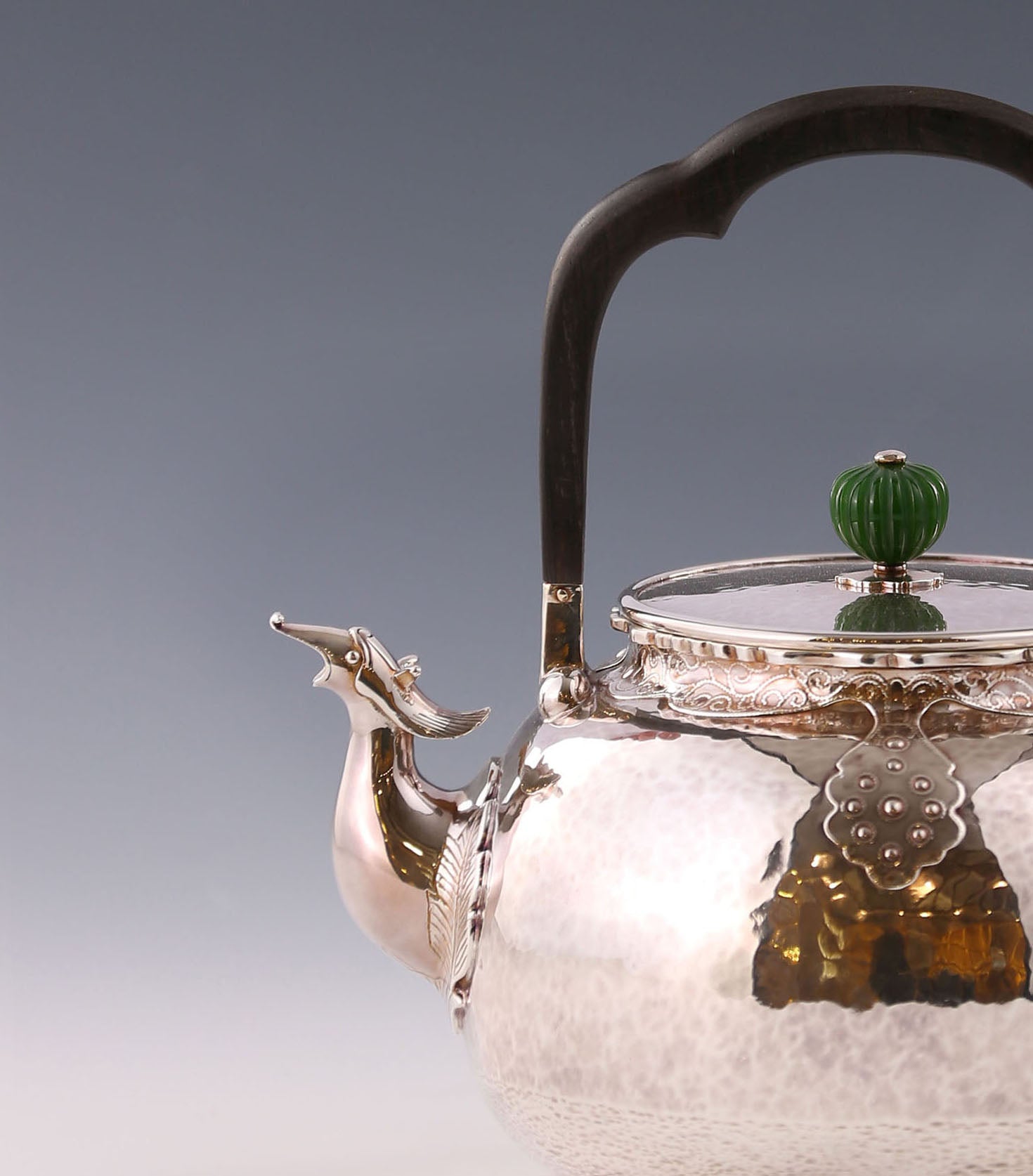 Silver ewer with phoenix head and cloud shoulder design