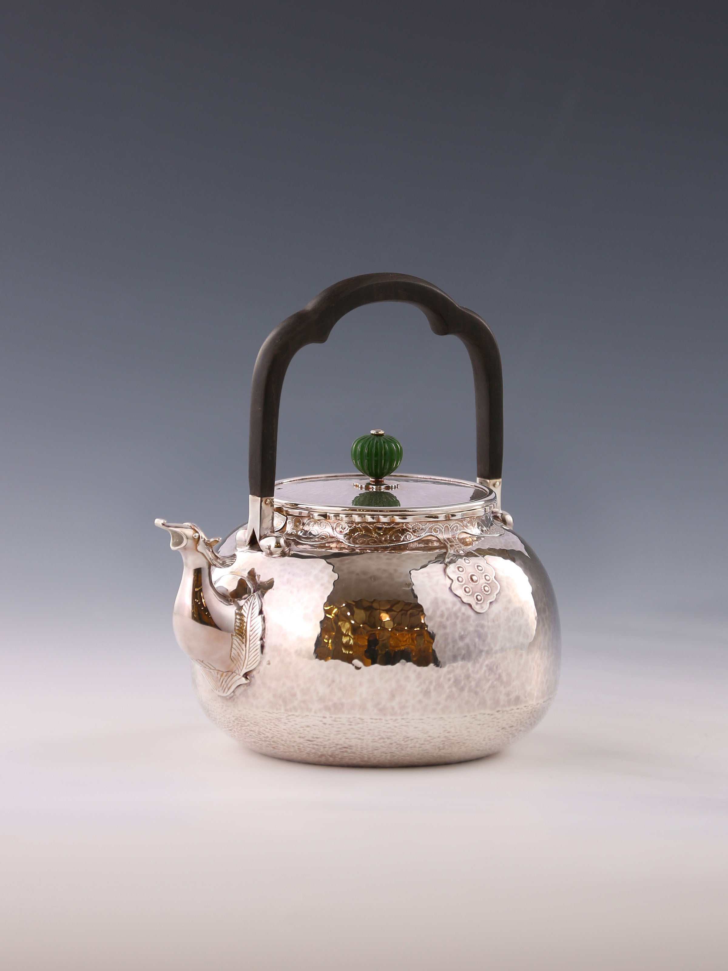 Silver ewer with phoenix head and cloud shoulder design