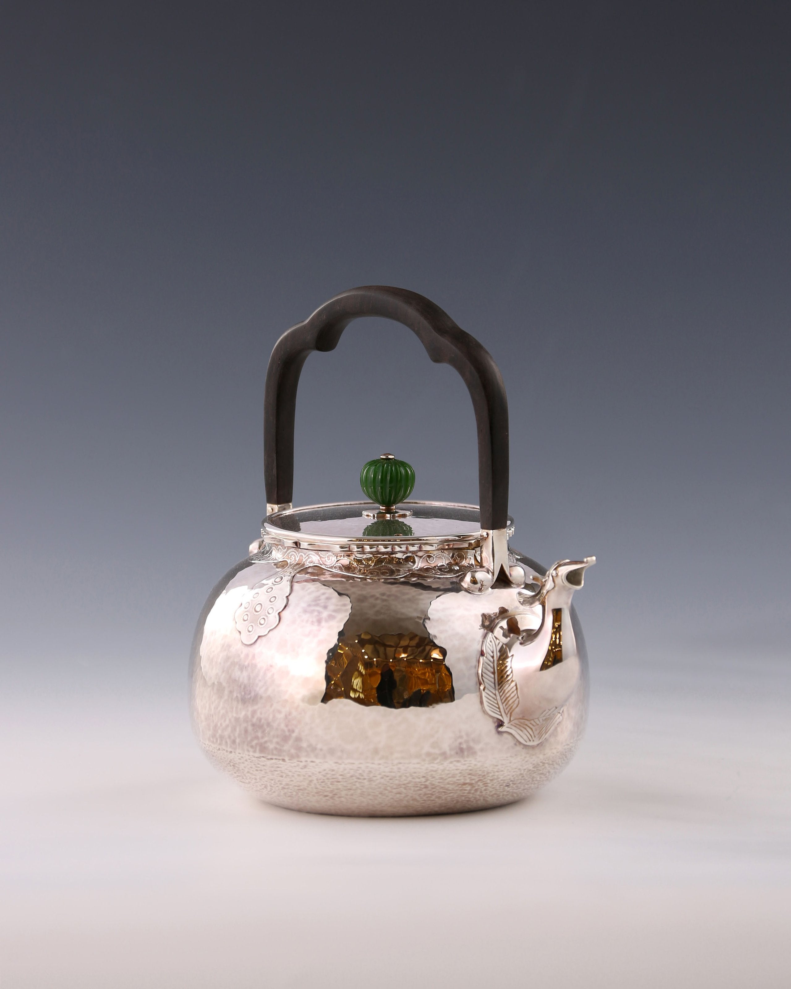 Silver ewer with phoenix head and cloud shoulder design