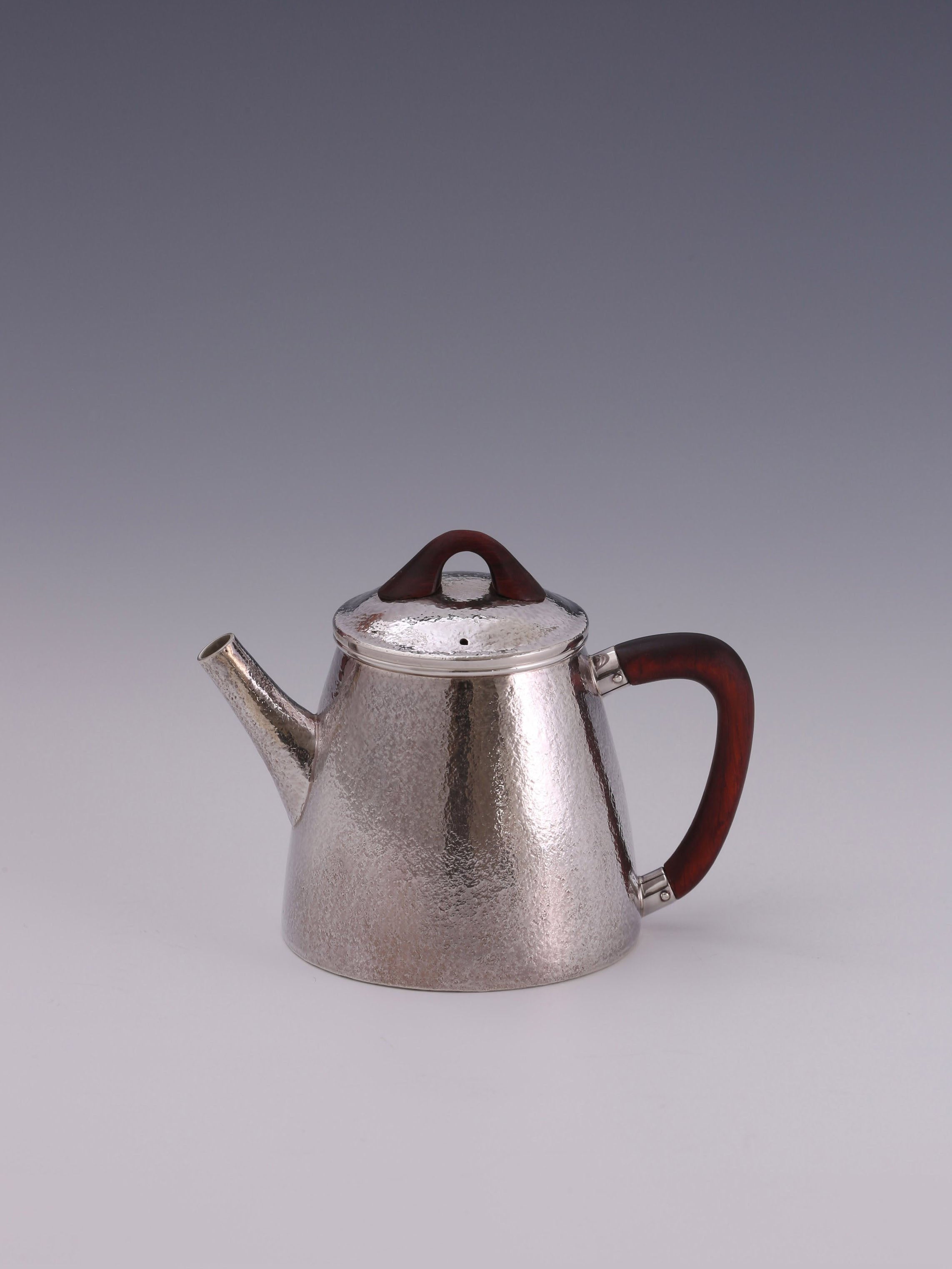 High stone silver tea pot