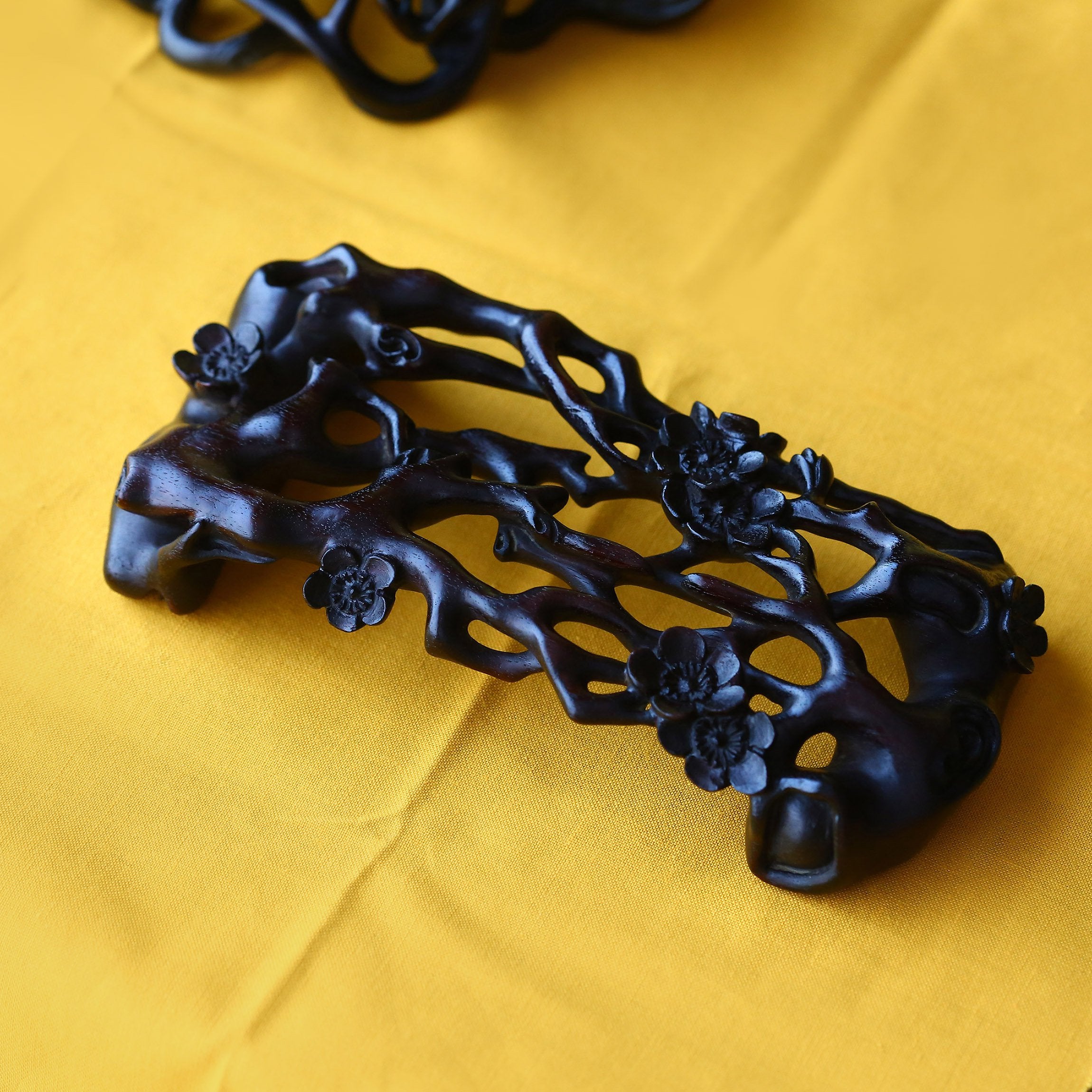 Three pieces with rosewood base featuring plum blossom, lingzhi, and begonia patterns.