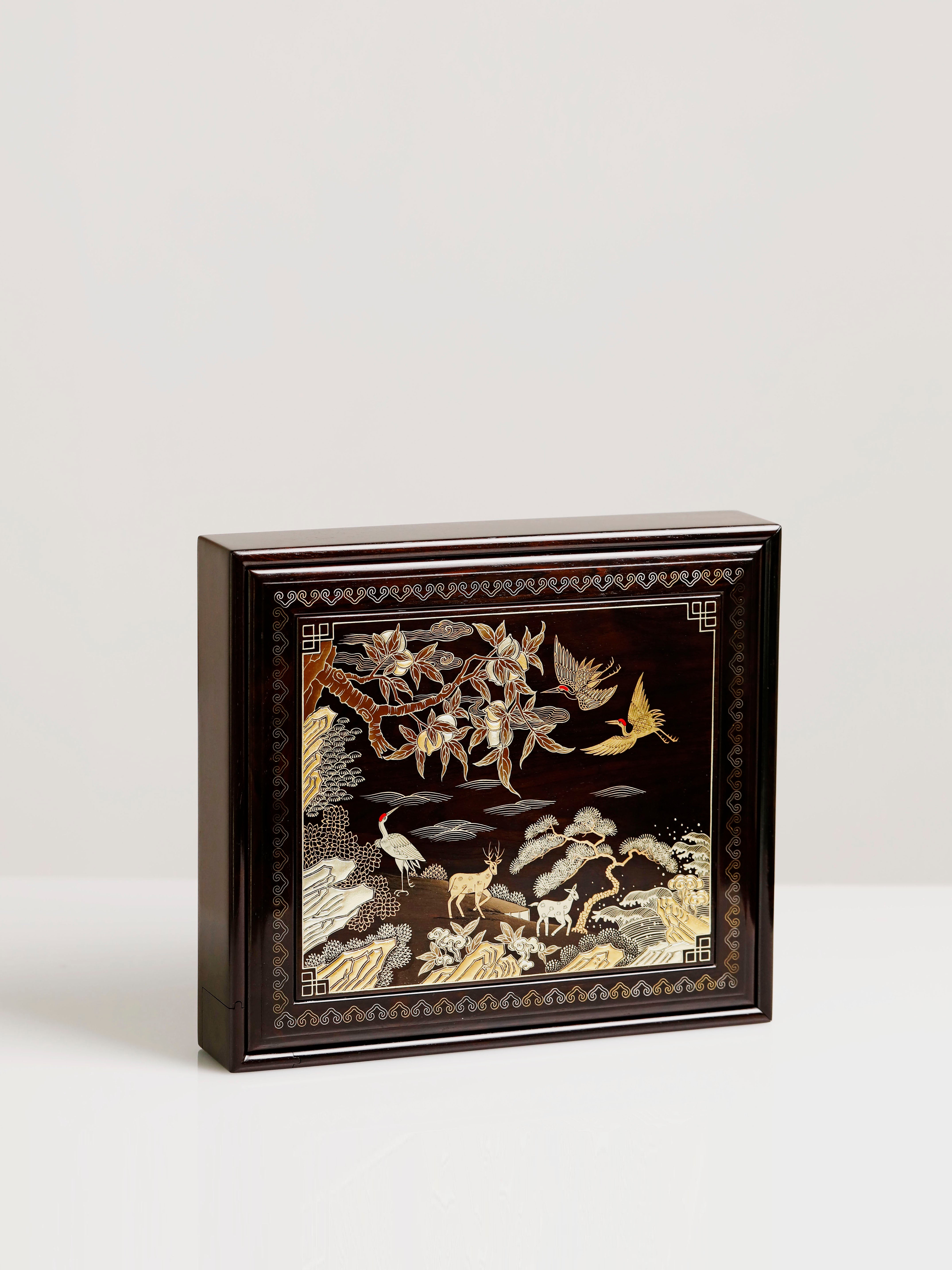 Purple sandalwood tea box with a design of cranes and deer symbolizing spring / Qingshantan tea drinking scene, gilded pull-out design