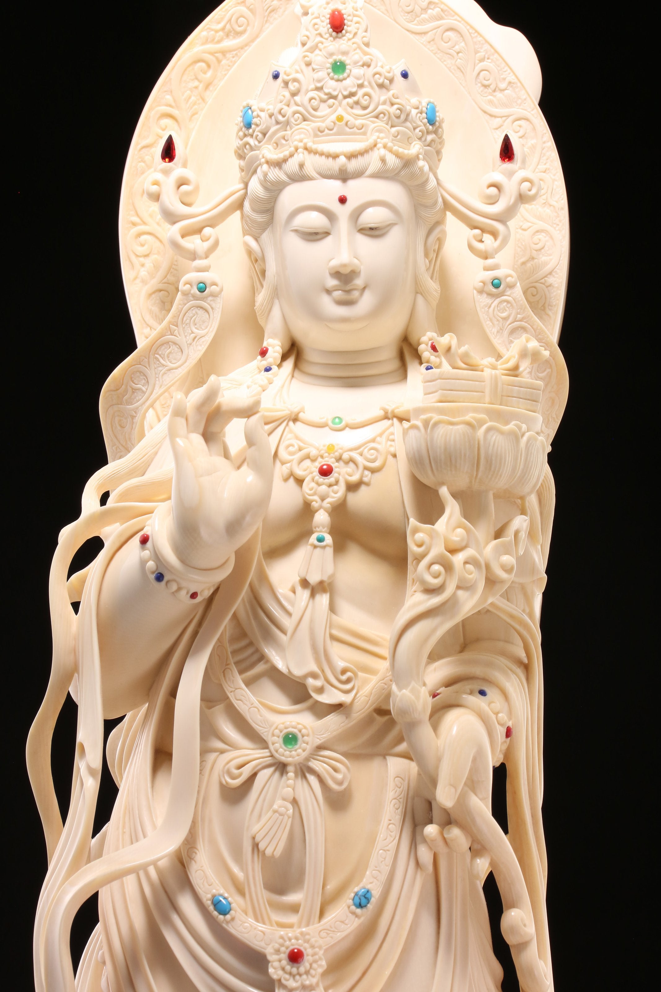 Guanyin holding a lotus and riding a dragon