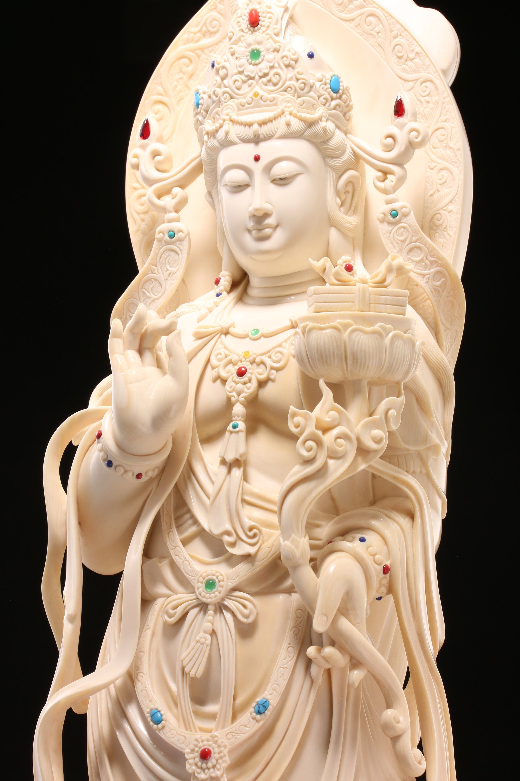 Guanyin holding a lotus and riding a dragon