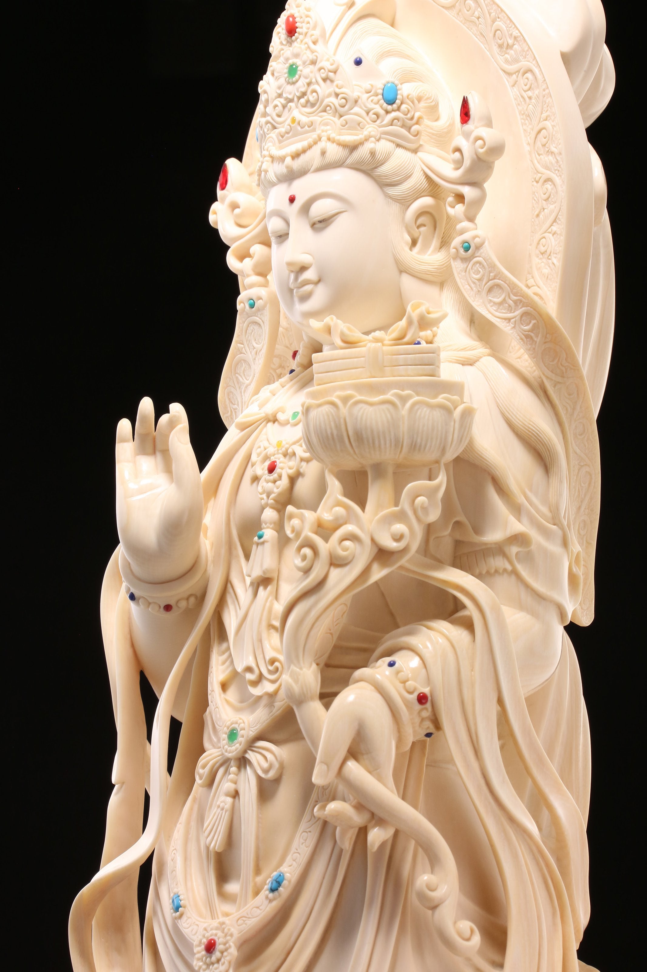 Guanyin holding a lotus and riding a dragon
