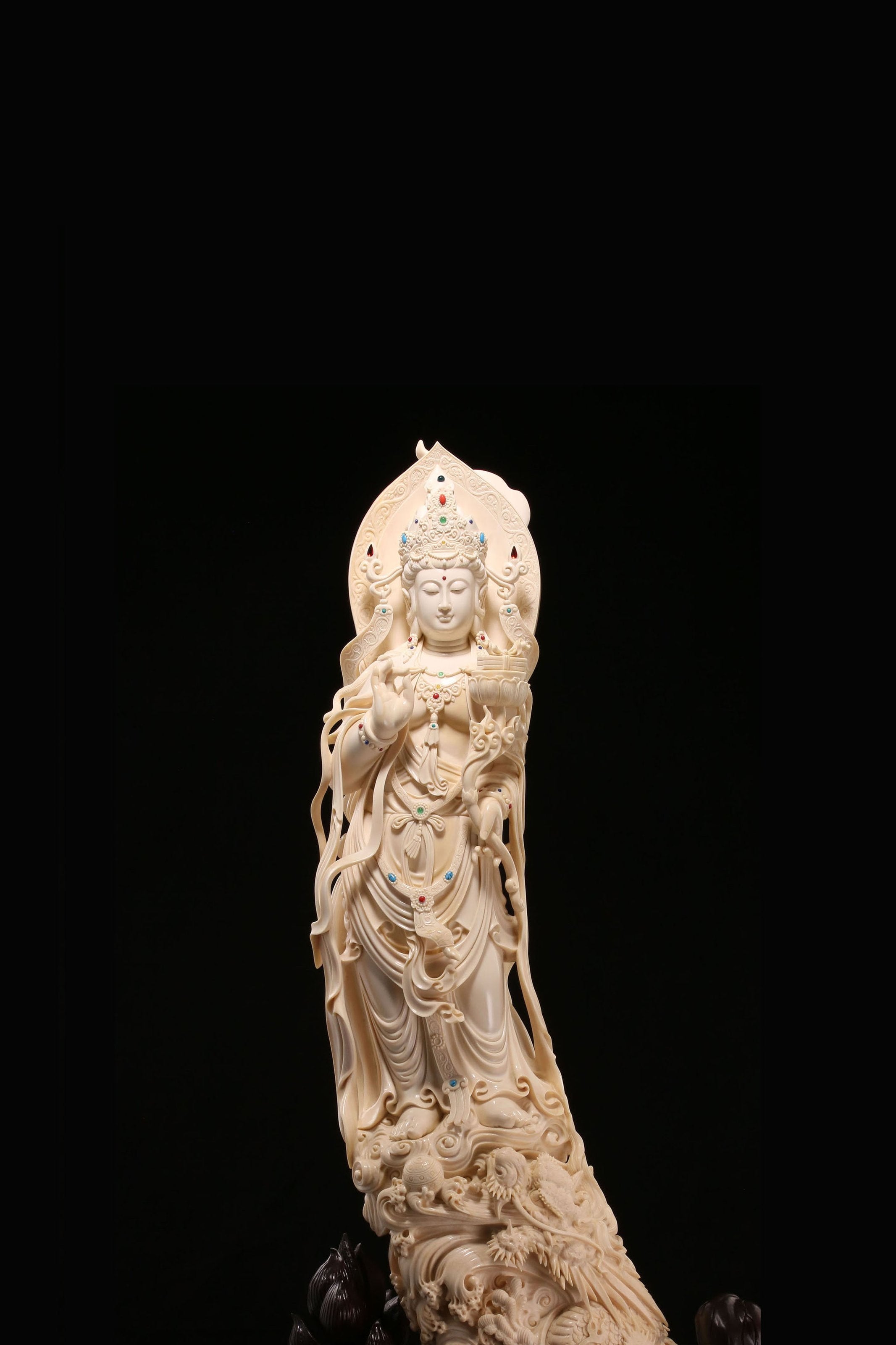 Guanyin holding a lotus and riding a dragon